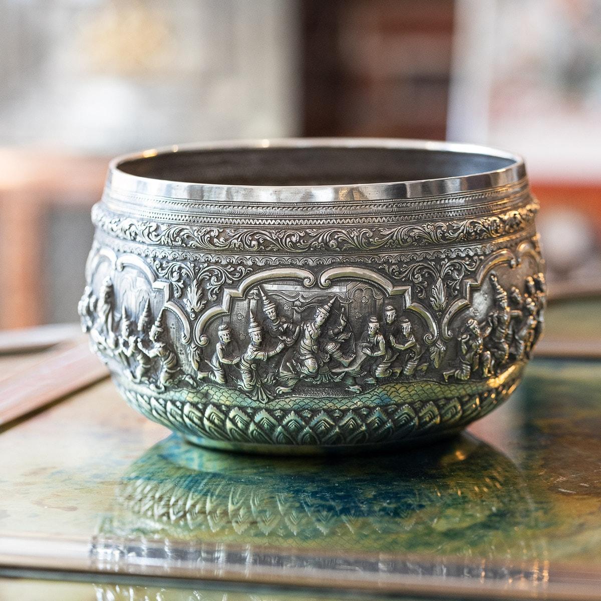 Antique 19th Century Exceptional Burmese, Myanmar solid silver thabeik bowl, repousse' decorated in high relief depicting different traditional scenes from the Burmese mythology, showing detailed figures set against a chiseled matted background in