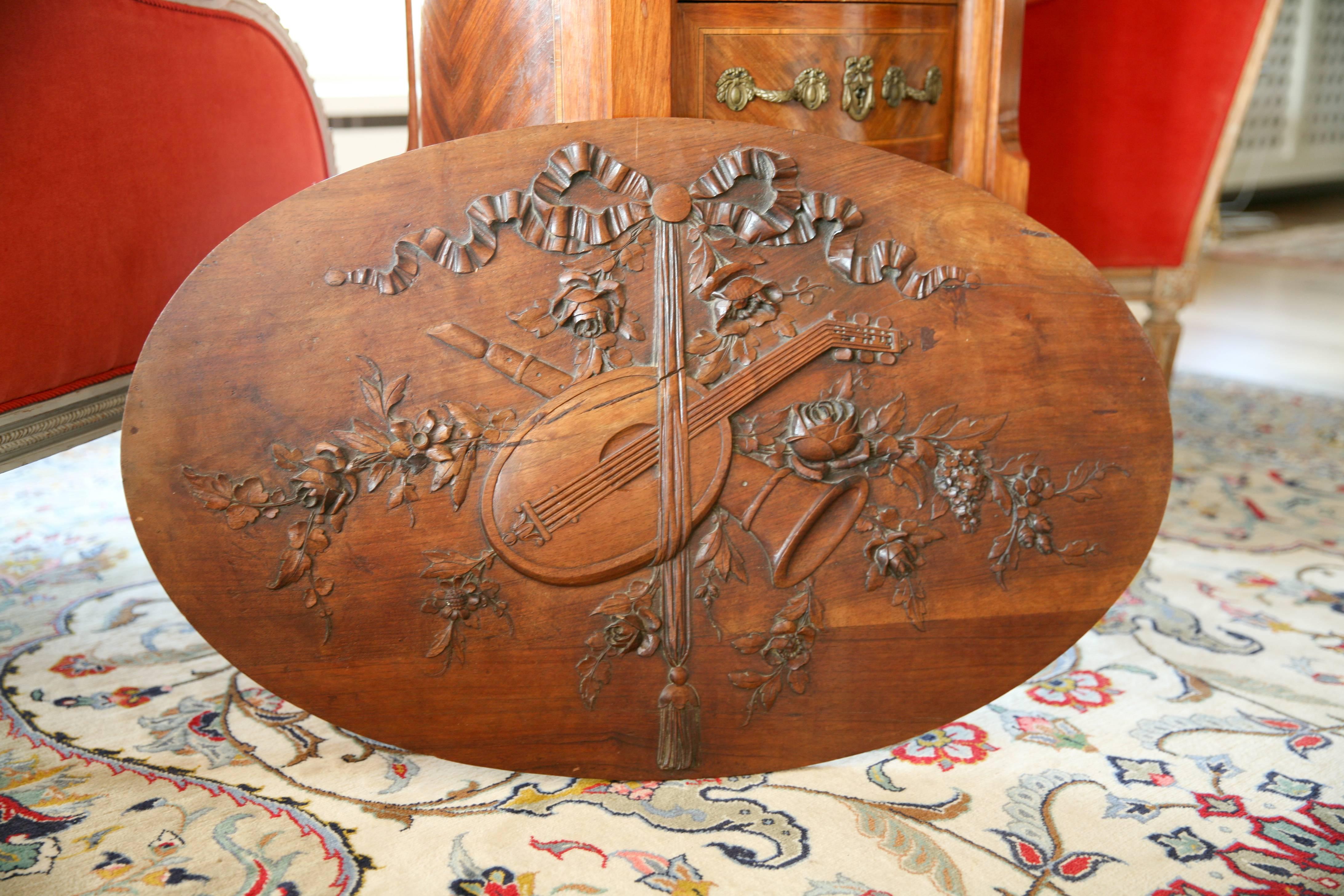 A very fine piece of wall decoration in oval shape with beautiful carvings of musical instruments and flowers with the typical ribbon on the top. The piece is made of solid walnut.
France, circa 1830