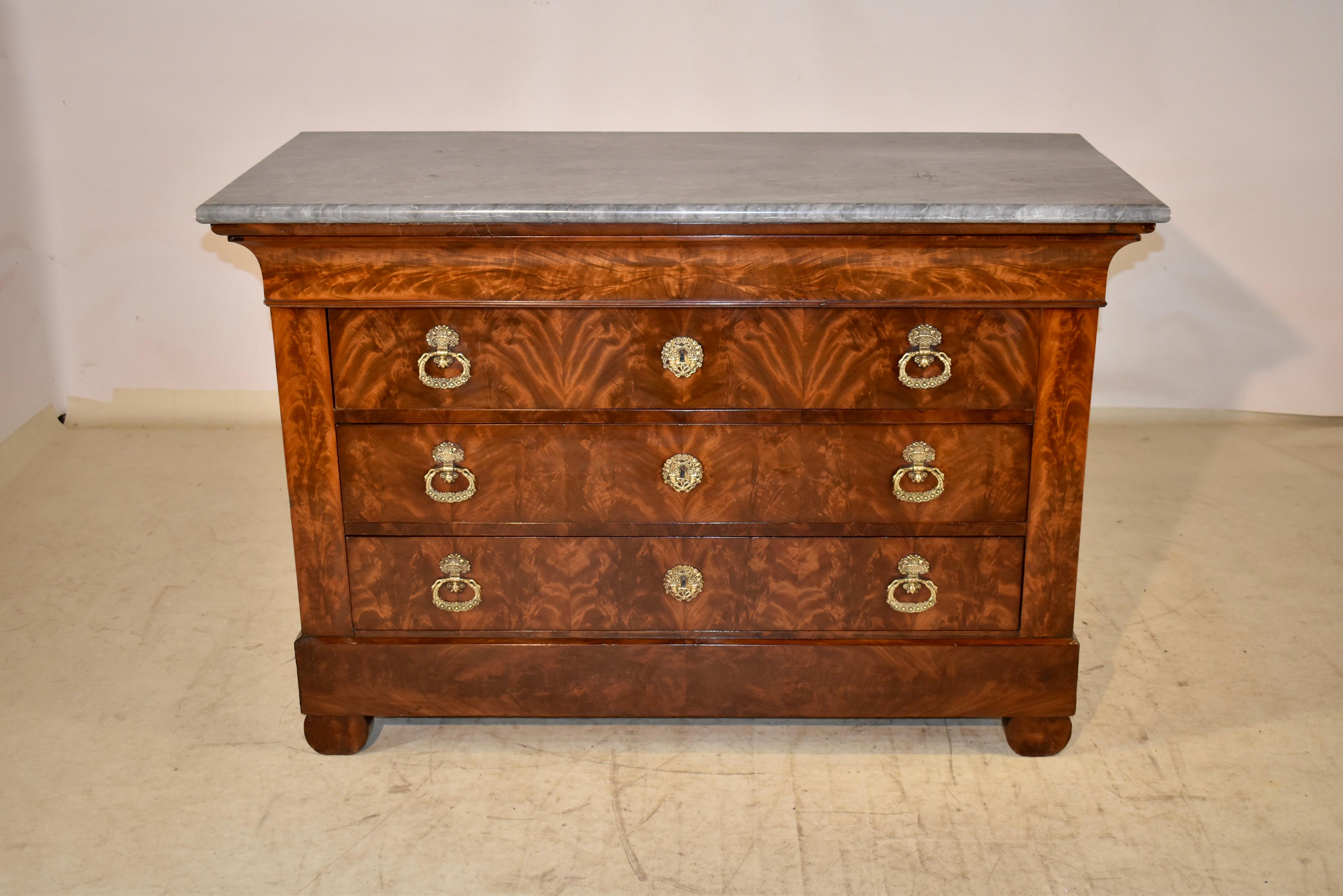 EXQUISITE 19th century Louis Philippe commode from France.  The top is a gorgeous gray marble with white matrix, sitting atop the case, made from beautifully grained mahogany.  The color is so rich throughout, with the graining it appears to move! 