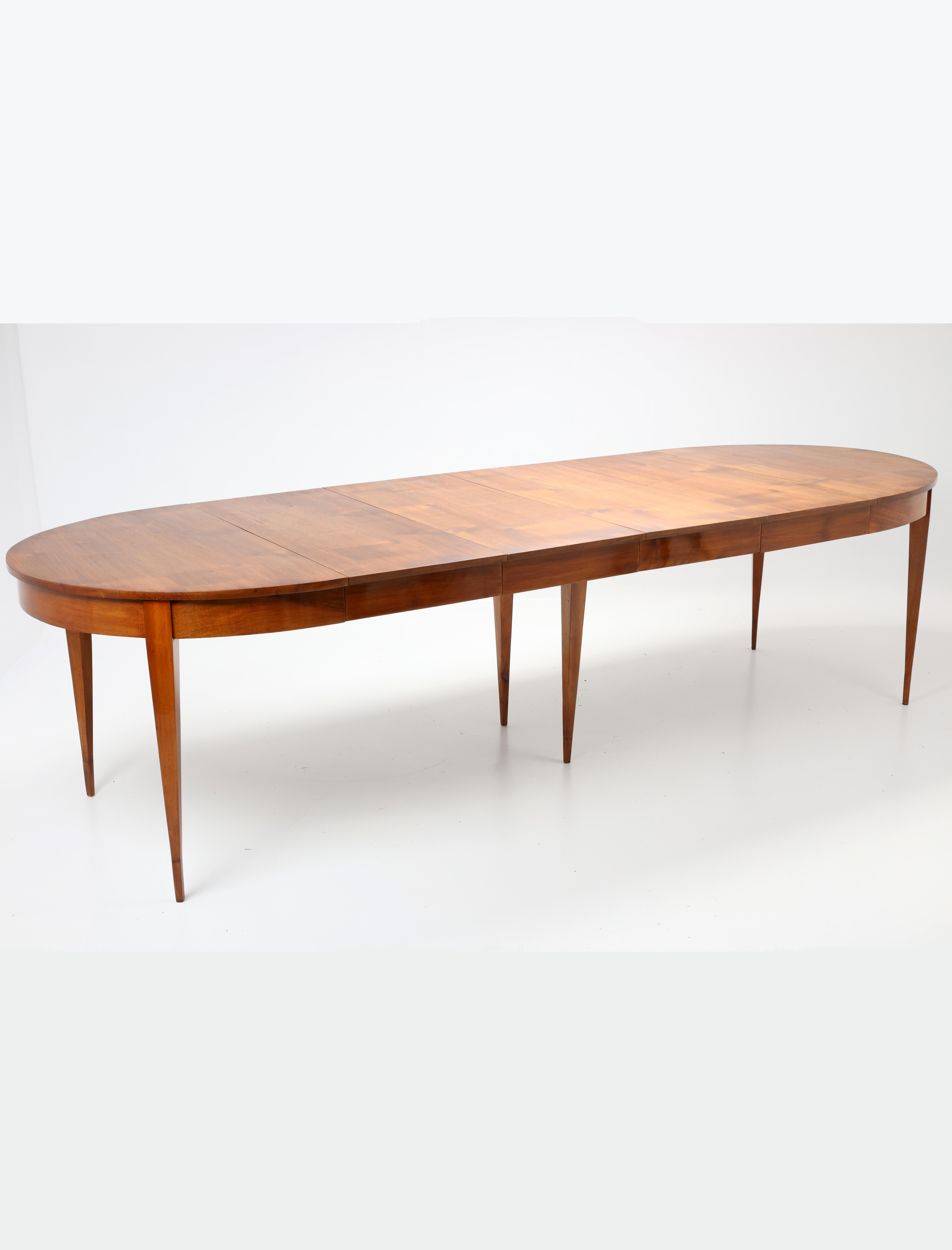 19th-Century Extendable Oval Dining Table

This exquisite 19th-century dining table features a beautifully veneered walnut top, oiled for practical durability while maintaining its natural elegance. The base and legs are finished with a
