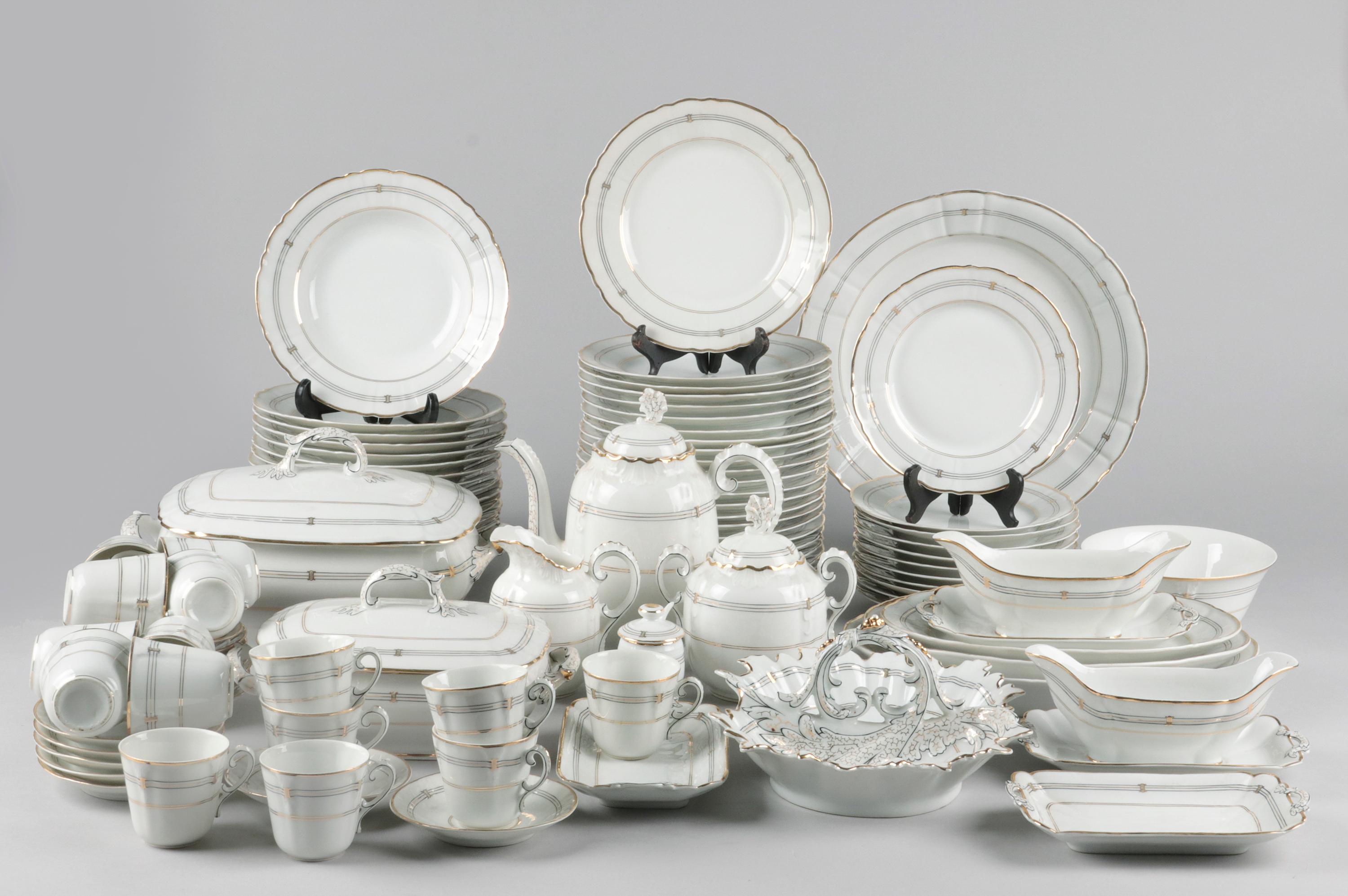 Beautiful antique porcelain tableware. It is an extensive set with many plates and beautiful serving dishes. This type of service is known as 'Vieux Paris', white porcelain from the French capital that was painted with sumptuous decors in many small