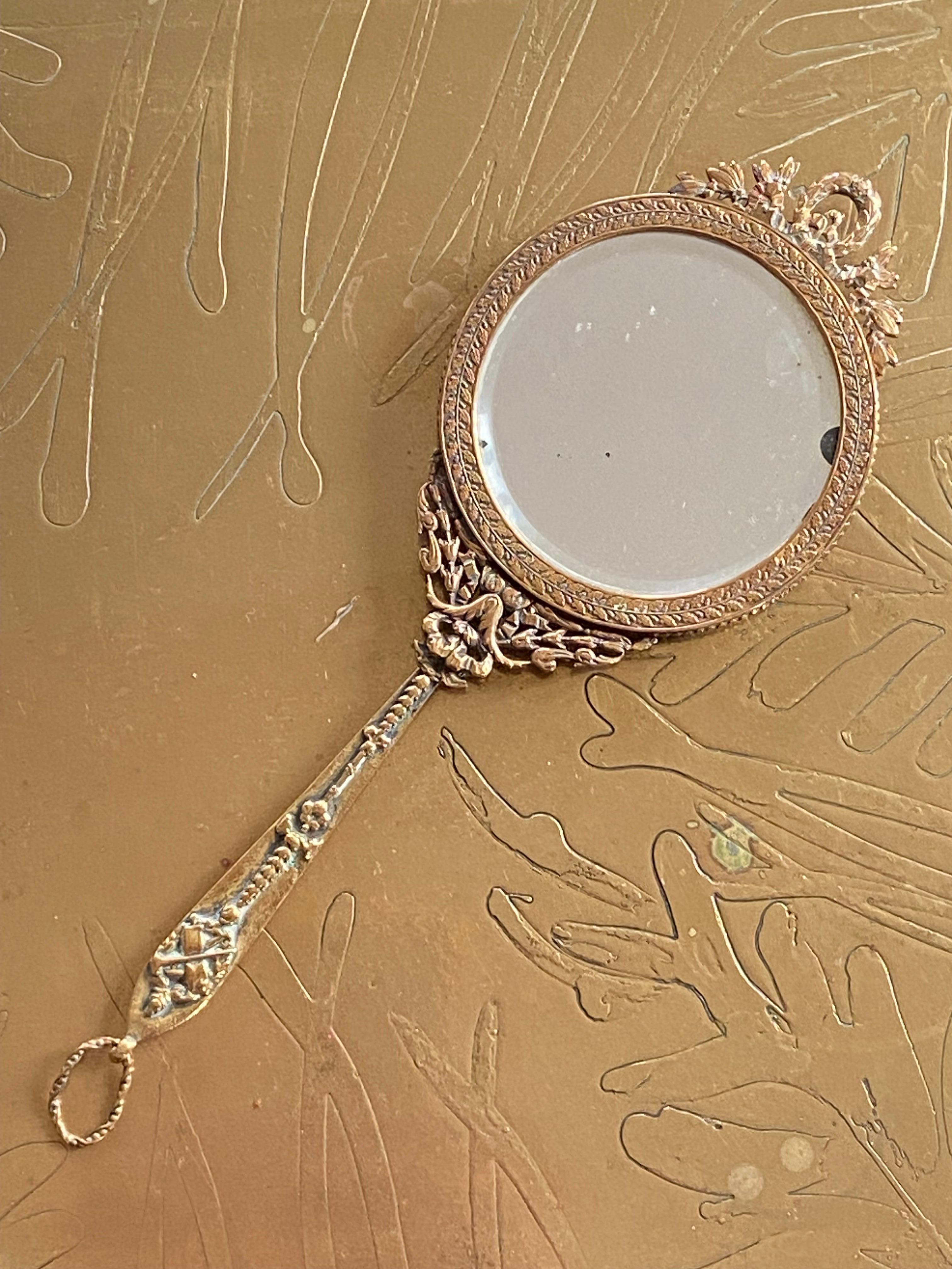 Extremely delicate and fine hand mirror made of engraved metal with finest decoration and a small portrait at the back of the piece.
Very good original condition with no restorations ever made.
France, circa 1860.