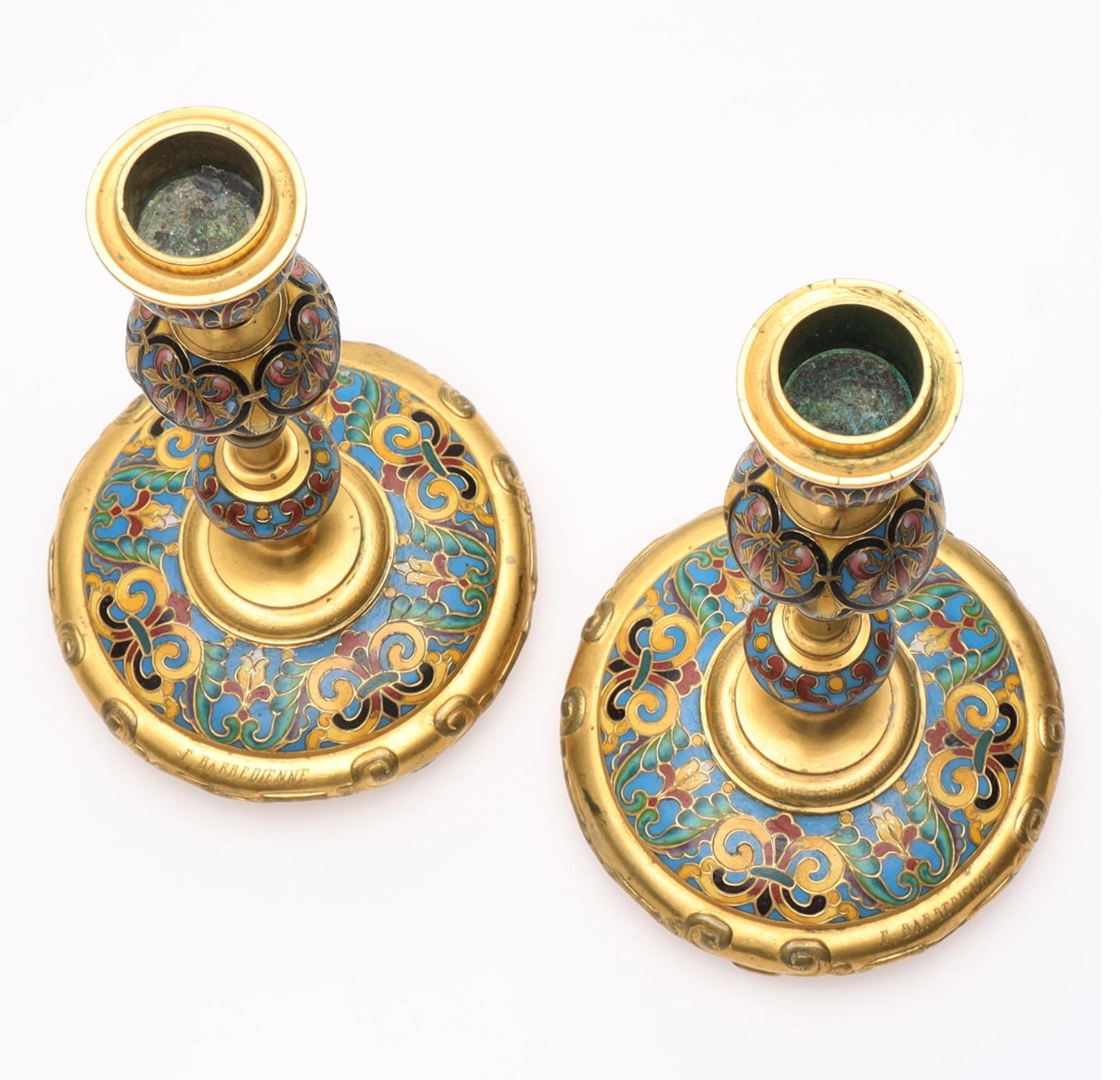 A fine pair of champlevé enamel candlesticks in a chinoiserie style by Ferdinand Barbedienne (1810 - 1892), made in Paris ca.1880. Signed 