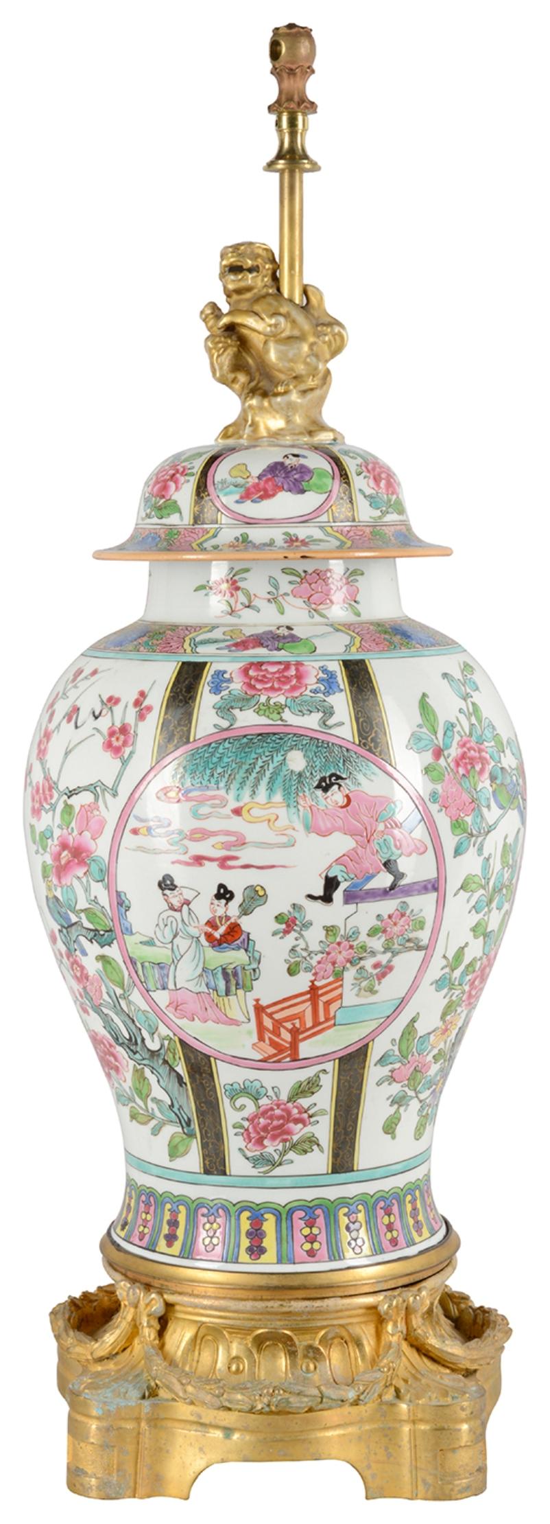 A very good quality late 19th century Famille rose style Samson porcelain lidded vase / lamp. Having classical oriental scenes with flowers, folate and motif decoration, inset painted panels of figures, gilded dog of faux finial, mounted on a