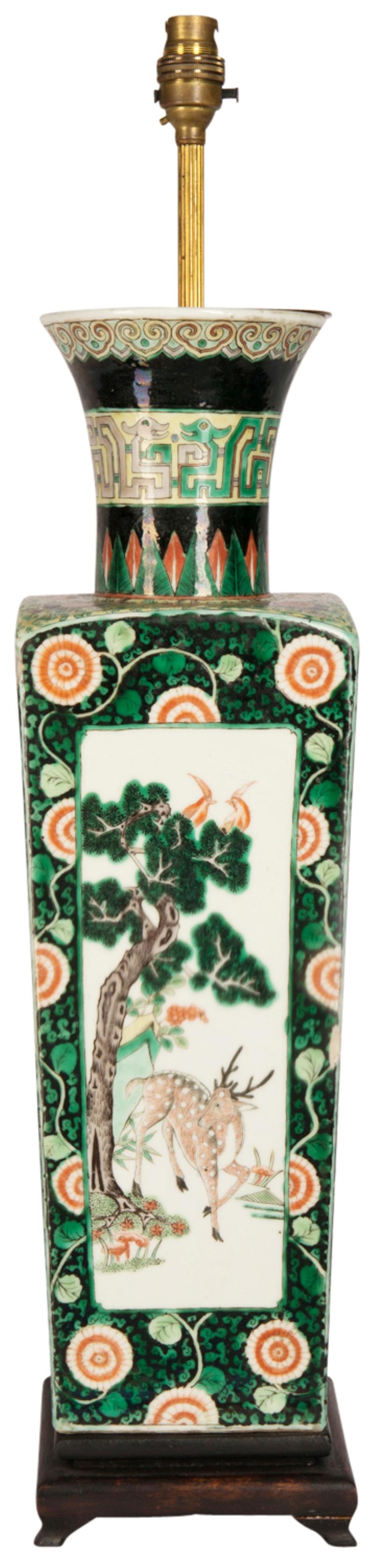 A good quality 19th century Chinese Famille Verte porcelain vase or lamp. Having the classical Green and Black ground, with scrolling foliate decoration, inset painted panels with exotic birds and flowers. Converted to a lamp.
