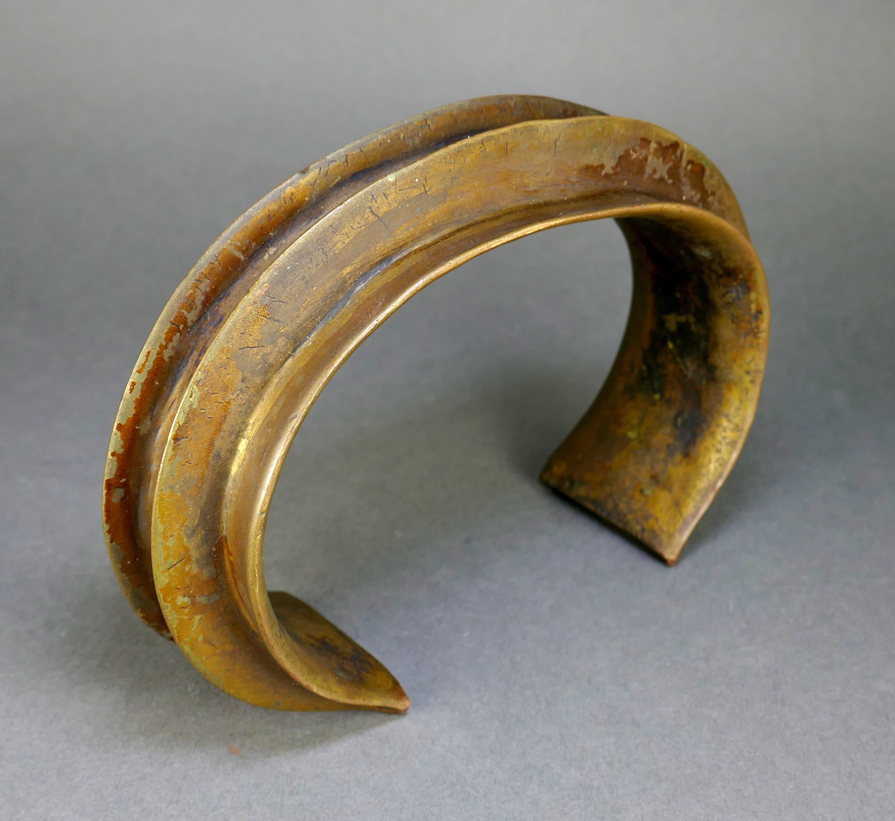 19th-century cast bronze Fang People torque neck collar from Gabon. The opening is 3.75 inches, and the piece weighs over three pounds. 