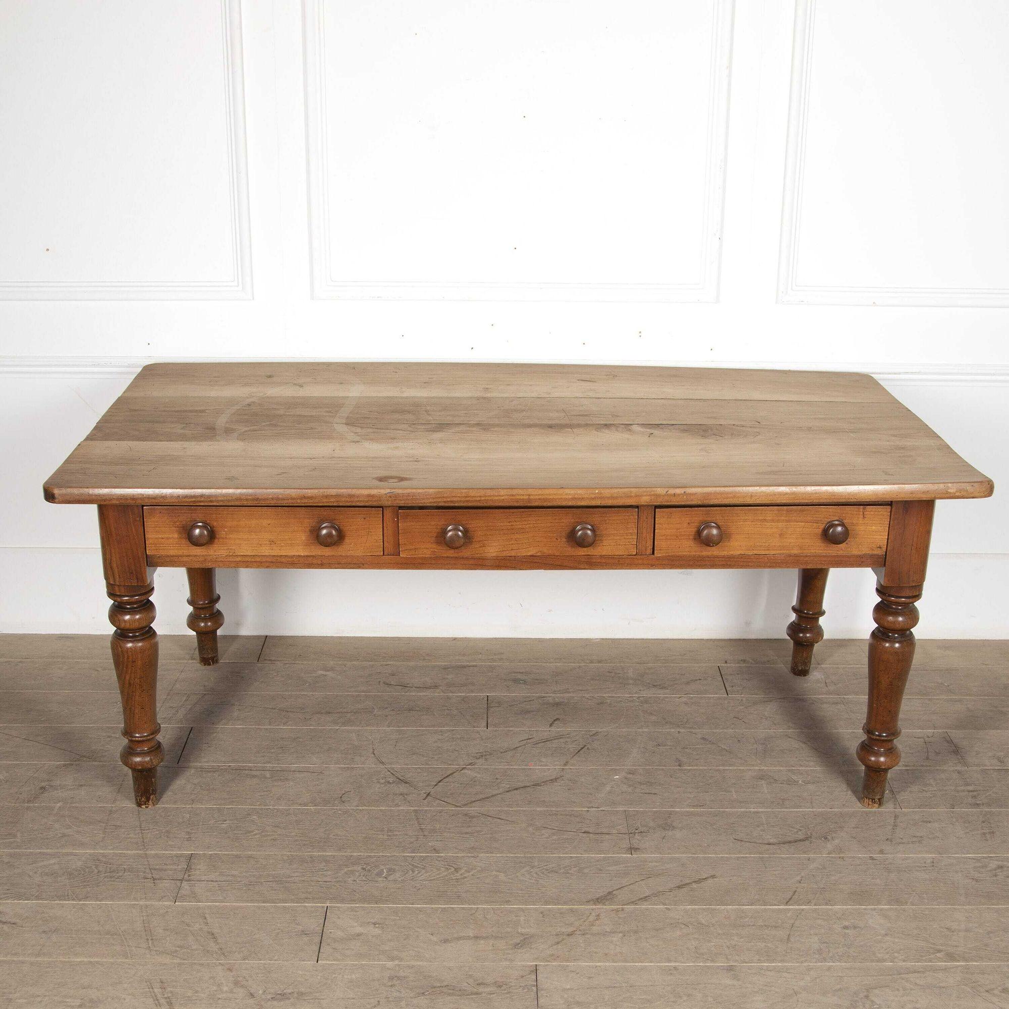 Substantial English sycamore and fruitwood Farmhouse kitchen table with three frieze drawers.
Ideal for a Country House Kitchen.
