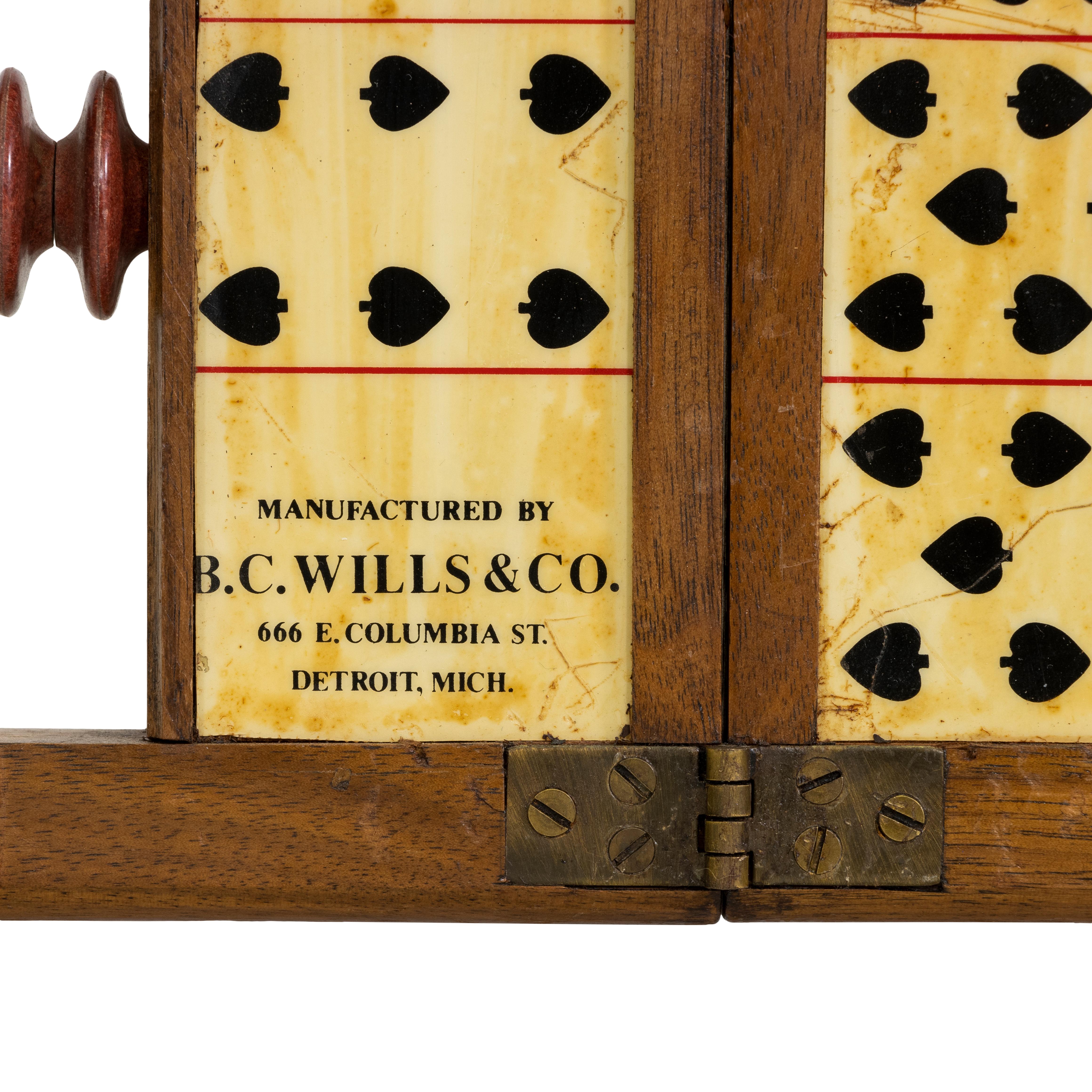 Faro case keeper in spades by B.C. Willis & Co., 666 E. Columbia St. Detroit, Michigan. This counter is folding type of walnut veneer measuring about 12