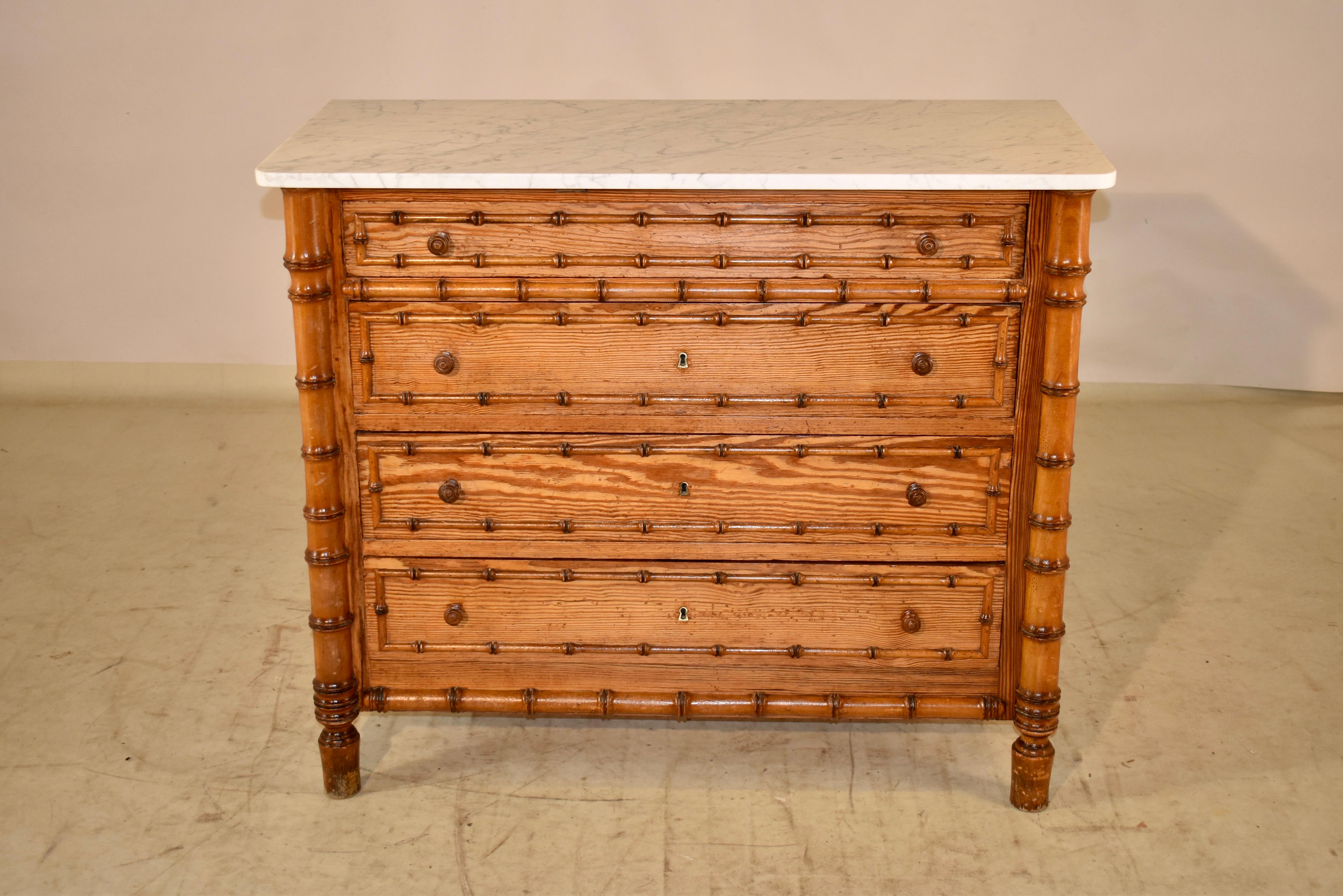 19th century Faux bamboo chest of the Art Nouveau period from France. This piece is made from pitch pine, and has lovely graining and a beautiful color. The top is made from Carrara Marble in white with a gorgeous matrix. The chest has simple sides,