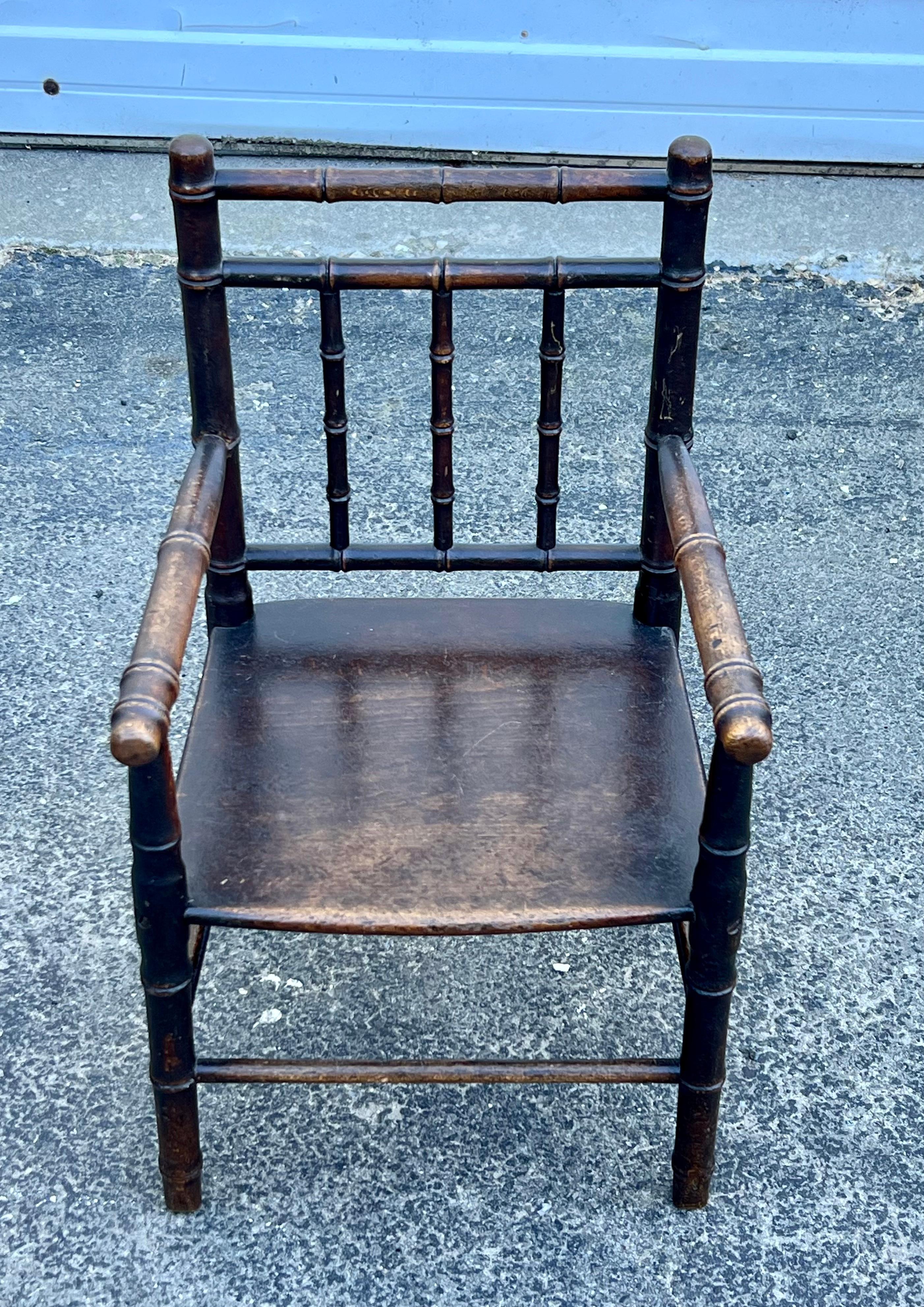 19th century faux bamboo child's armchair with plank seat.  Original finish and great size.