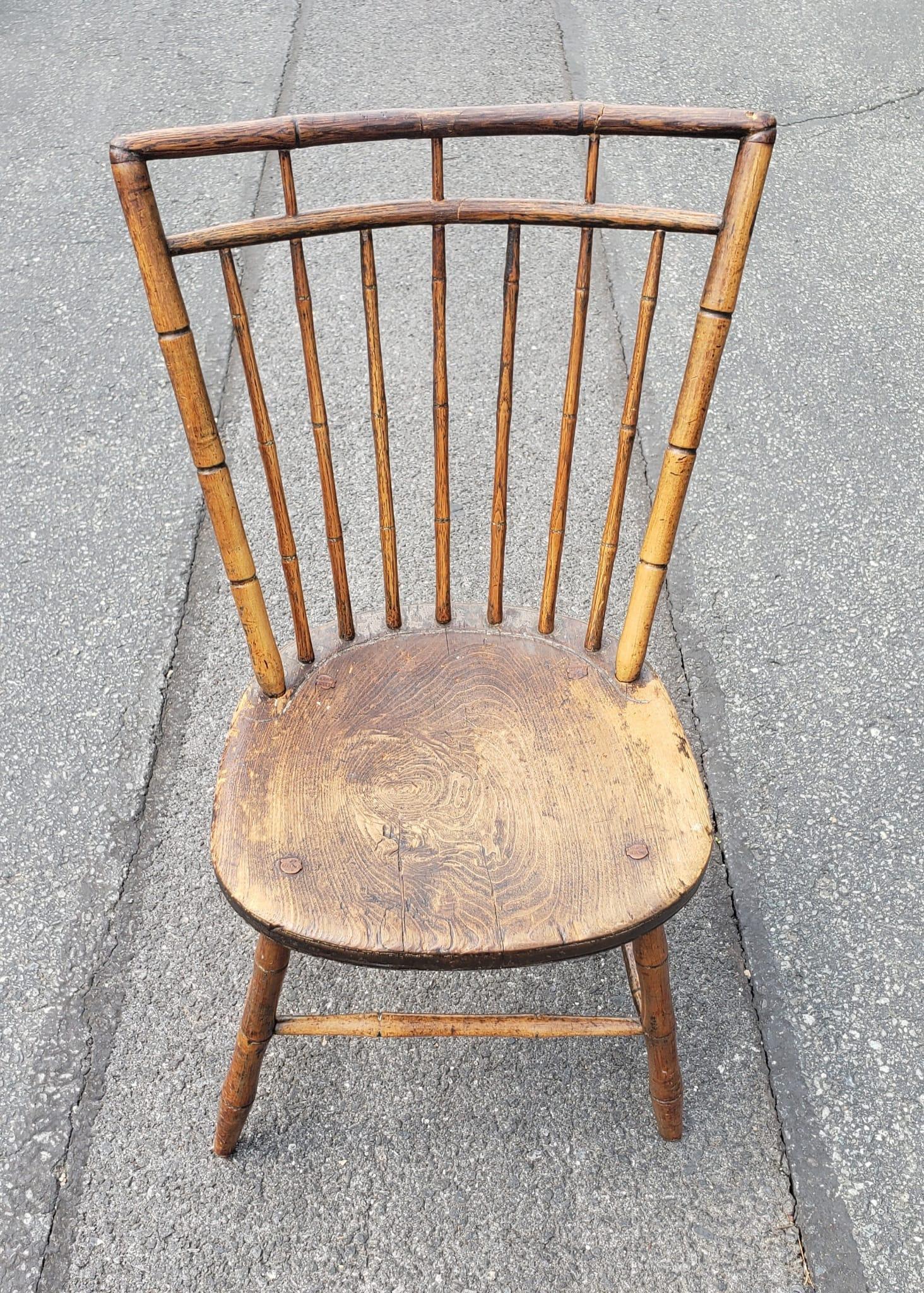 A 19th Century maple faux bamboo windsor side chair with patina. Meaurw 16