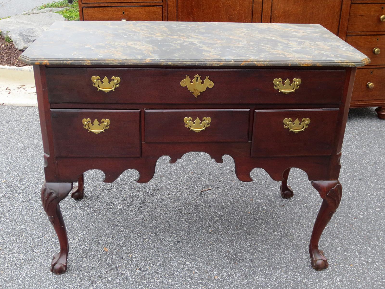 19th century faux marble-top lowboy with ball and claw feet
Four drawers, brass pulls.