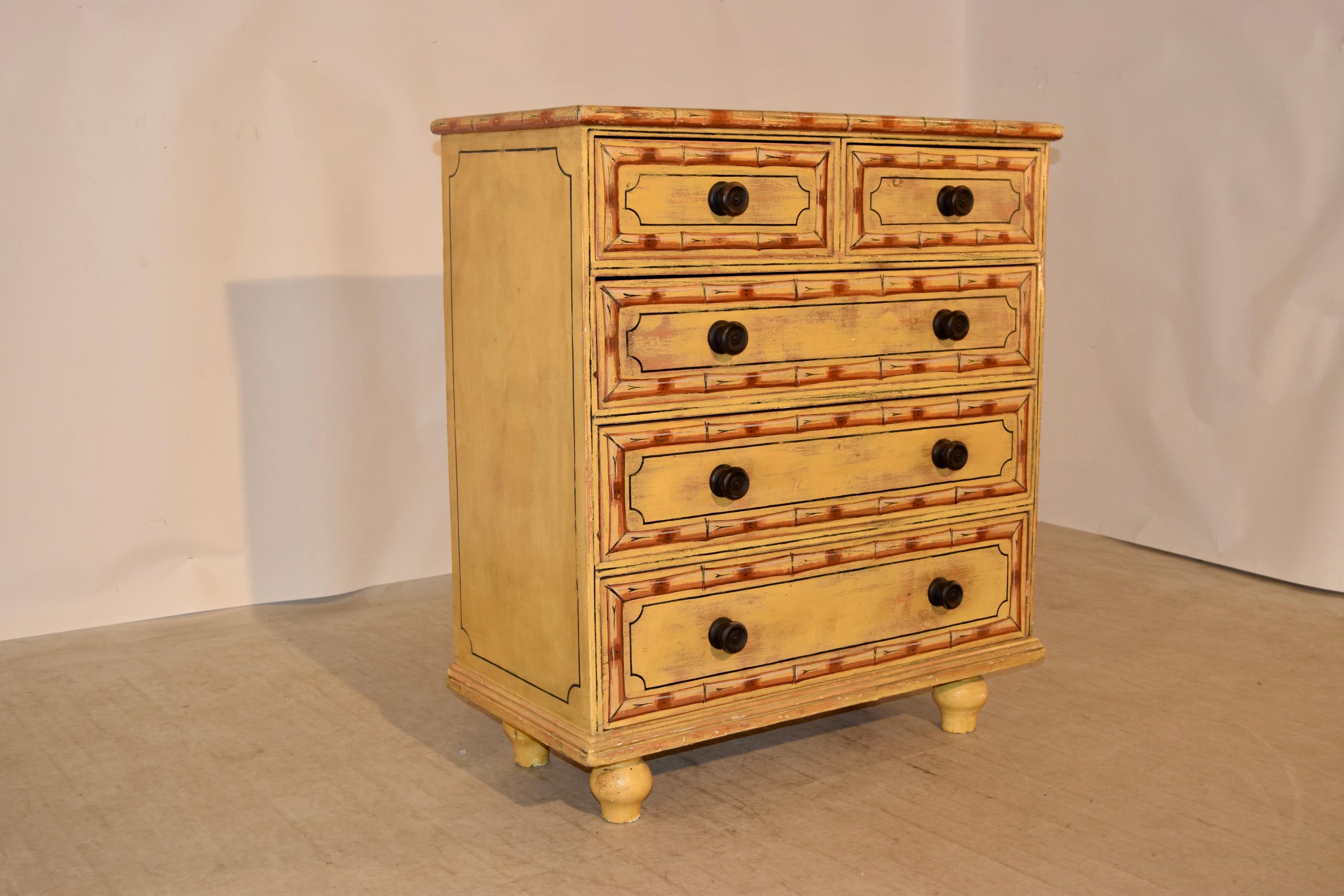 19th century English chest of drawers which has been faux painted to appear to have bamboo banding around the drawers and top. The sides are simple, and have faux painted panels as well. The case has two drawers over three drawers configuration, and