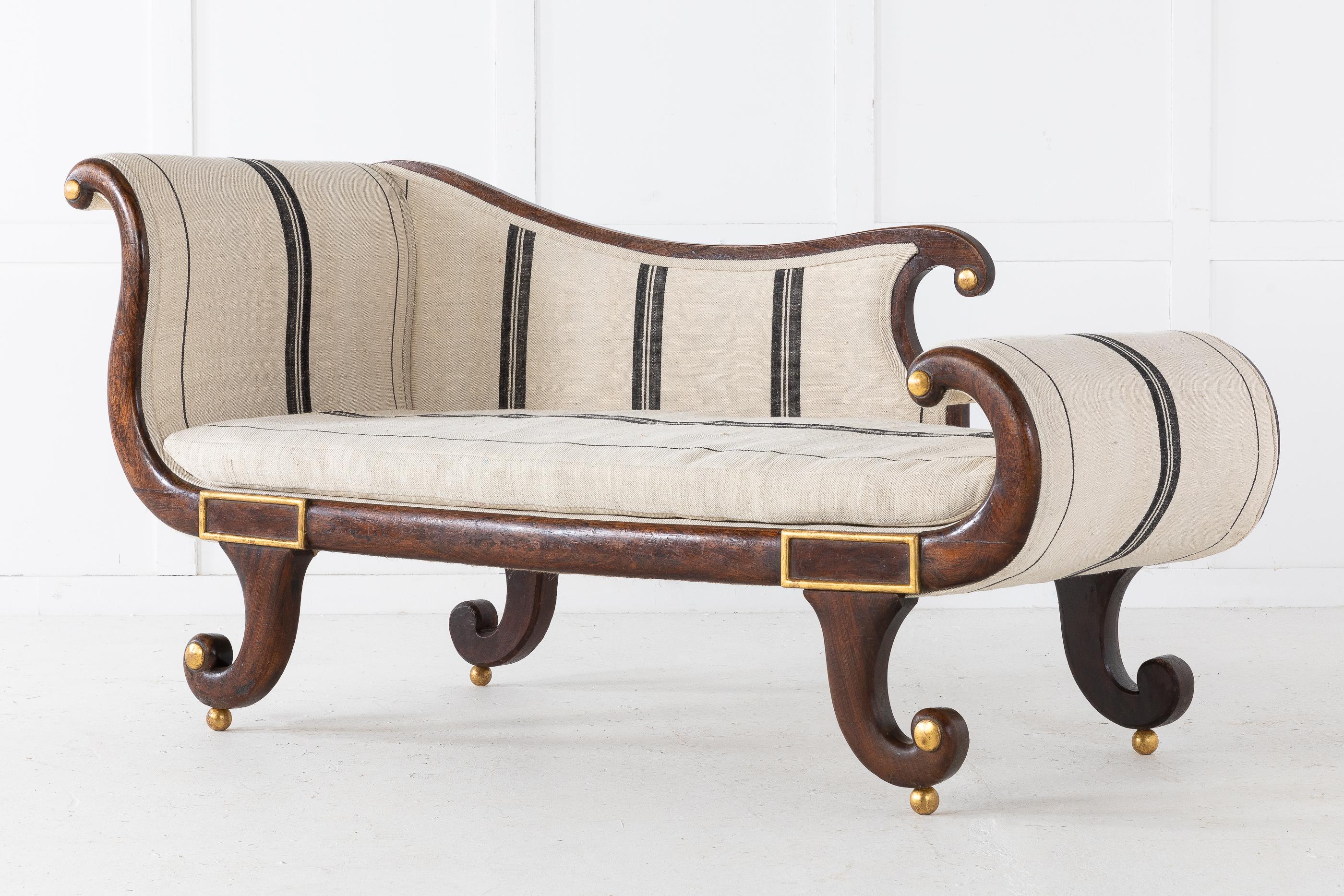 19th century English Regency simulated rosewood and gilt daybed with elegant flowing lines and nice small proportions. Fully upholstered in our workshop with antique linen.
Measures: Seat height 41
Seat depth 56.
