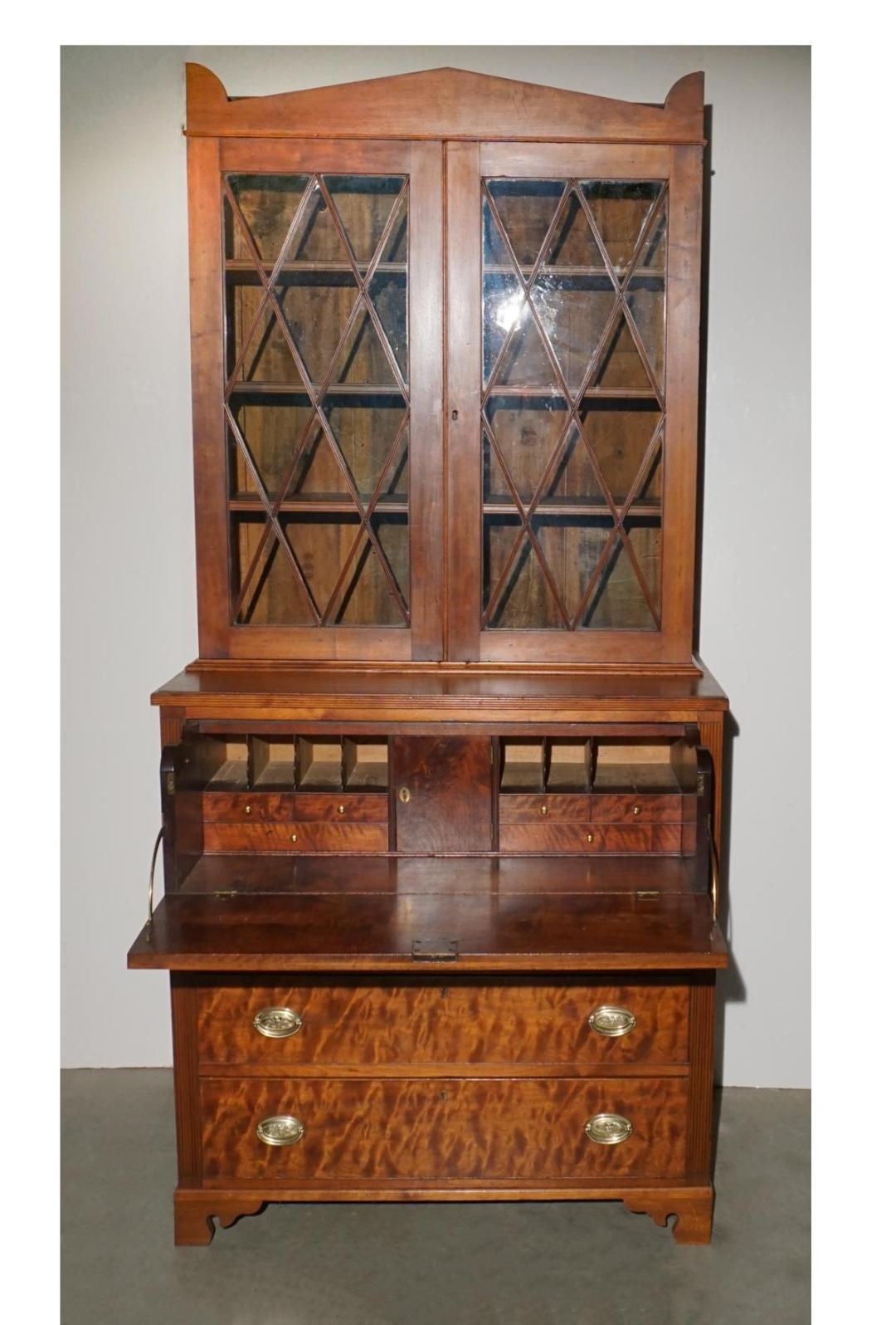 A 19th Century Curly Tiger Figured Walnut Butler two-part Fall Front Desk. Hand-rub refinished recently. Drawers operating smoothly. 
Measures 42