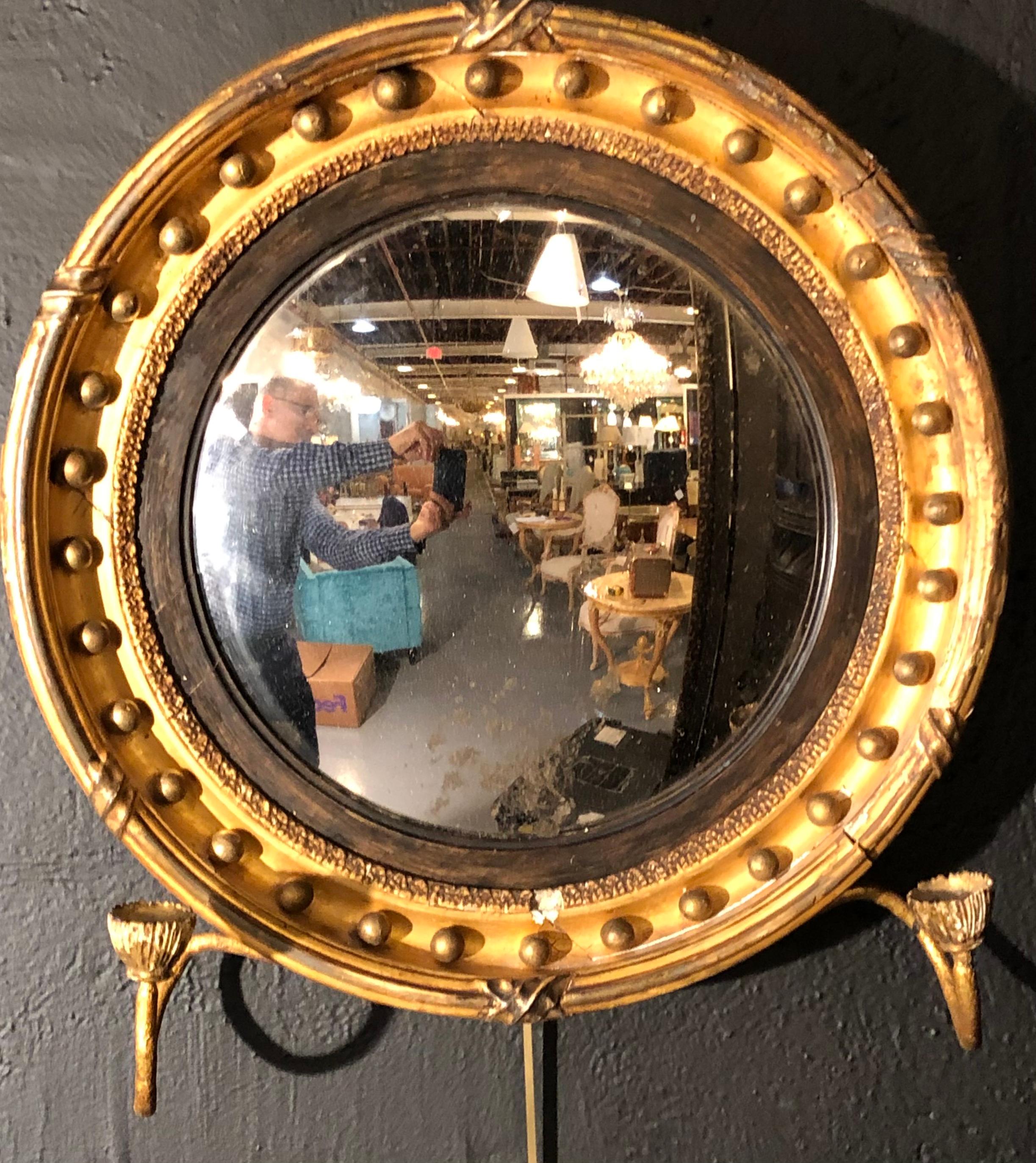 19th century federal giltwood bullseye convex mirror.
  