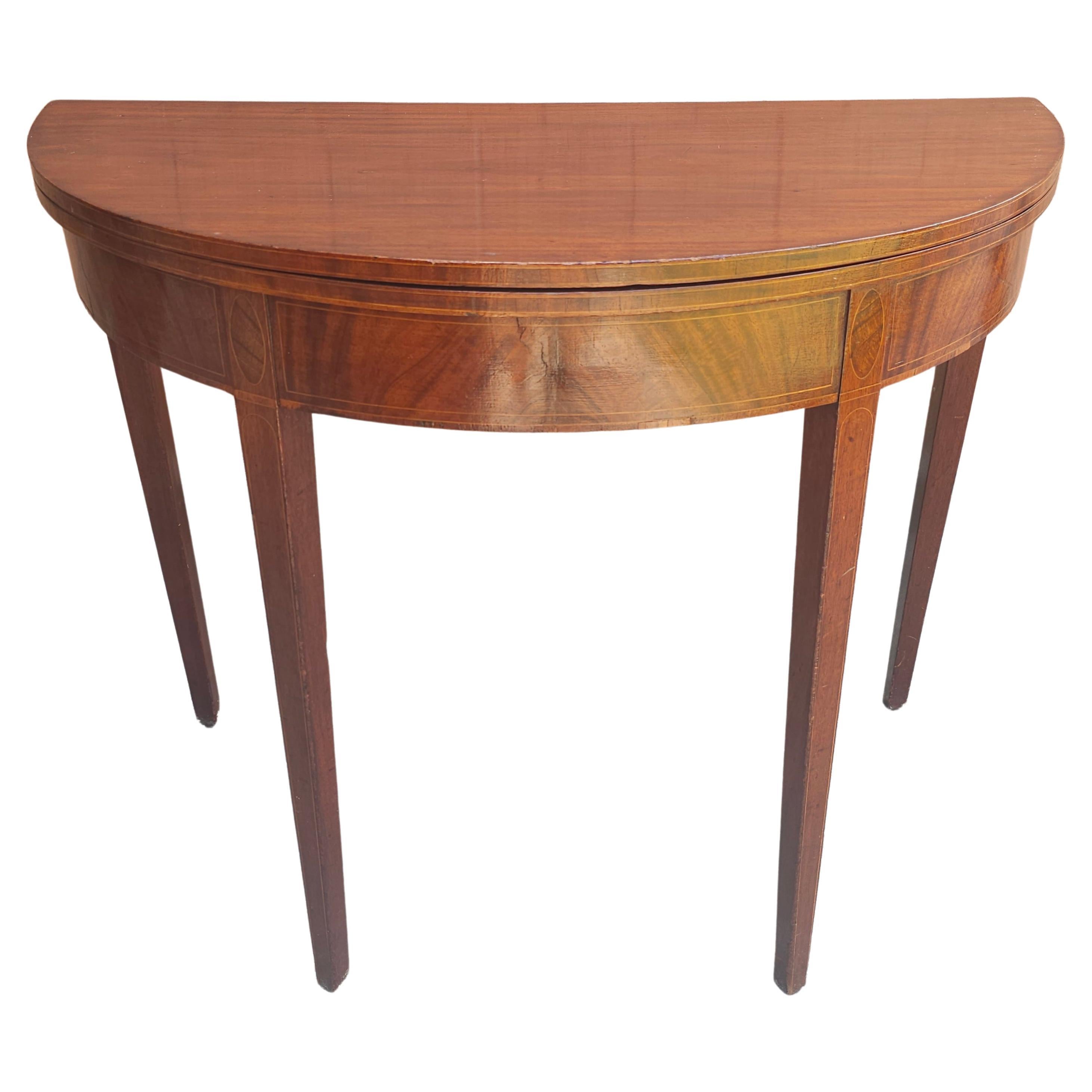 A 19th Century Federal Inlaid Mahogany Demilune Fold Top Console / Card Table in clean antique Condition. Measures 36