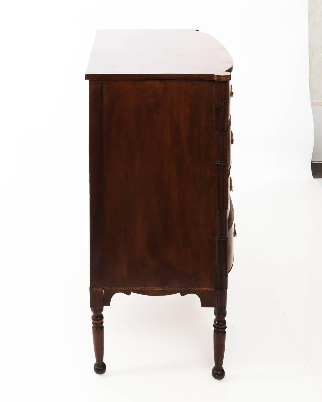 Federal Sheraton Bow Front Chest with string inlay, cookie corners and fluted columns, period early to mid 19th c.
 