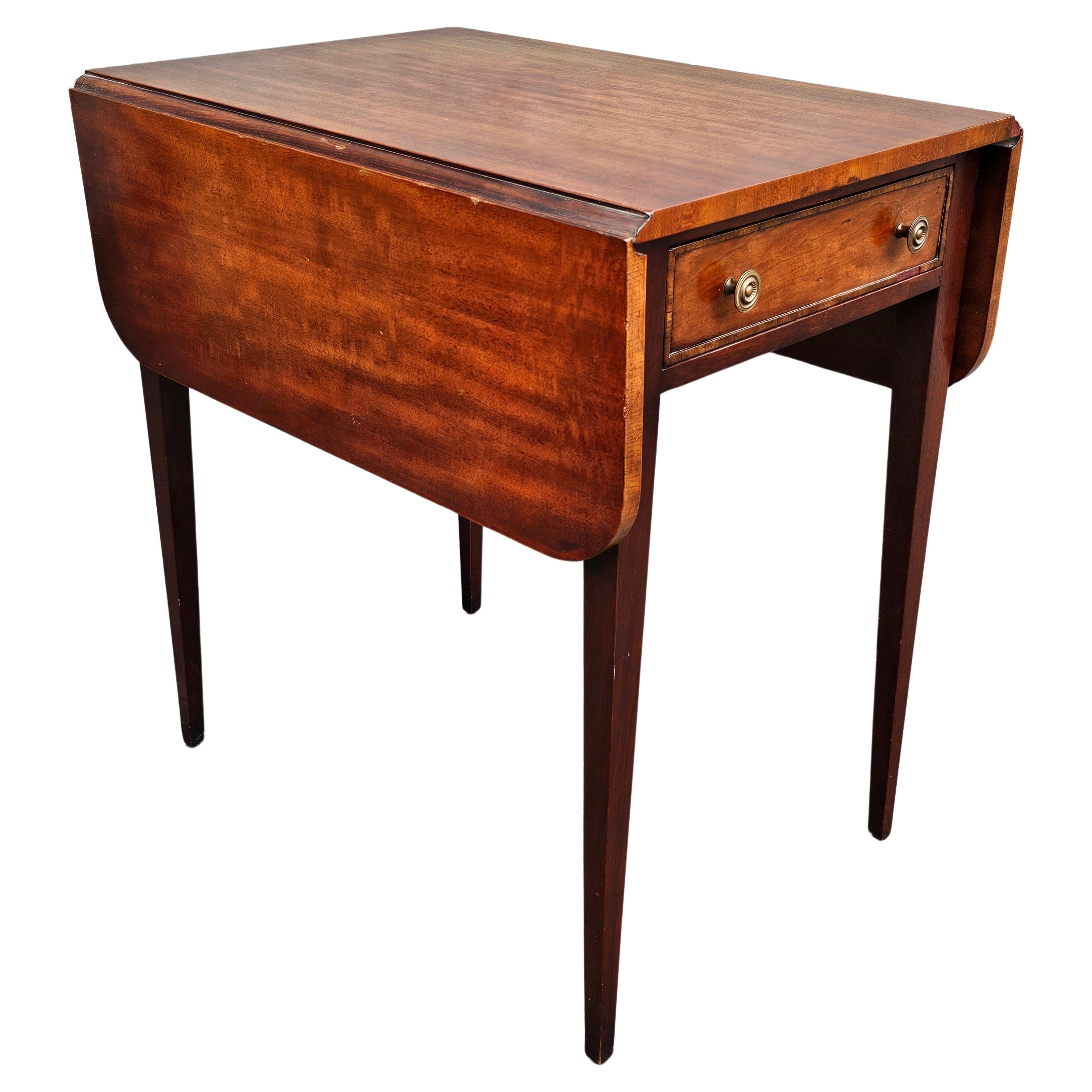 A 19th Century Federal Style Mahogany Pembroke Table . Measures 17.5