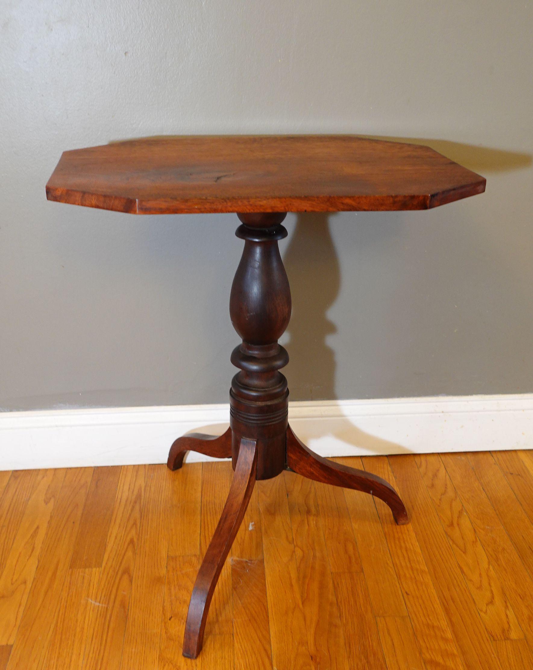 Elongated octagonal tilt top over finely turned column supported by three shapely legs.
Measures: 27 1/2