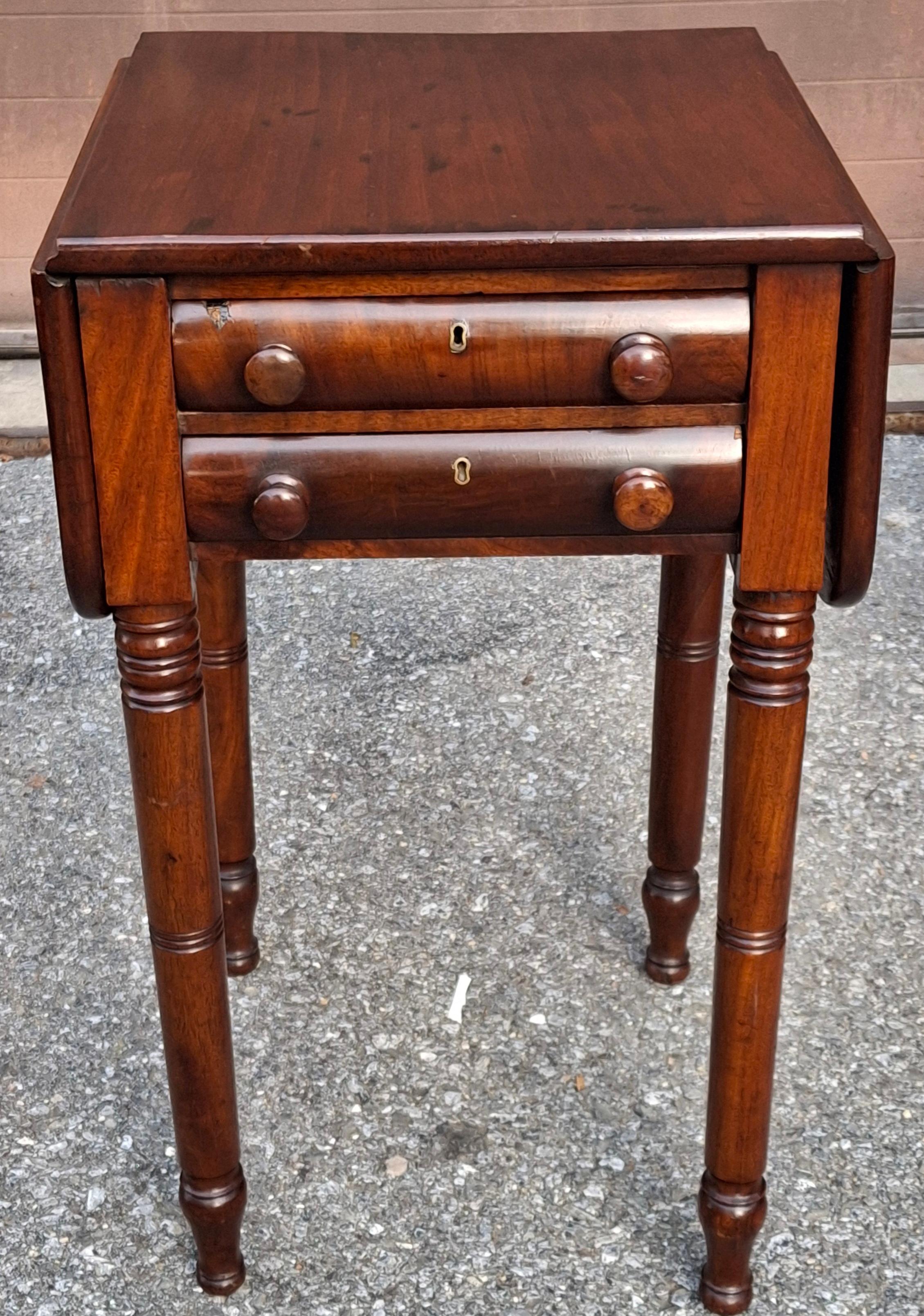 A 19th Century Federal Varnished Pine Two-Drawer Drop Leaf Work Table.
Measures: 17