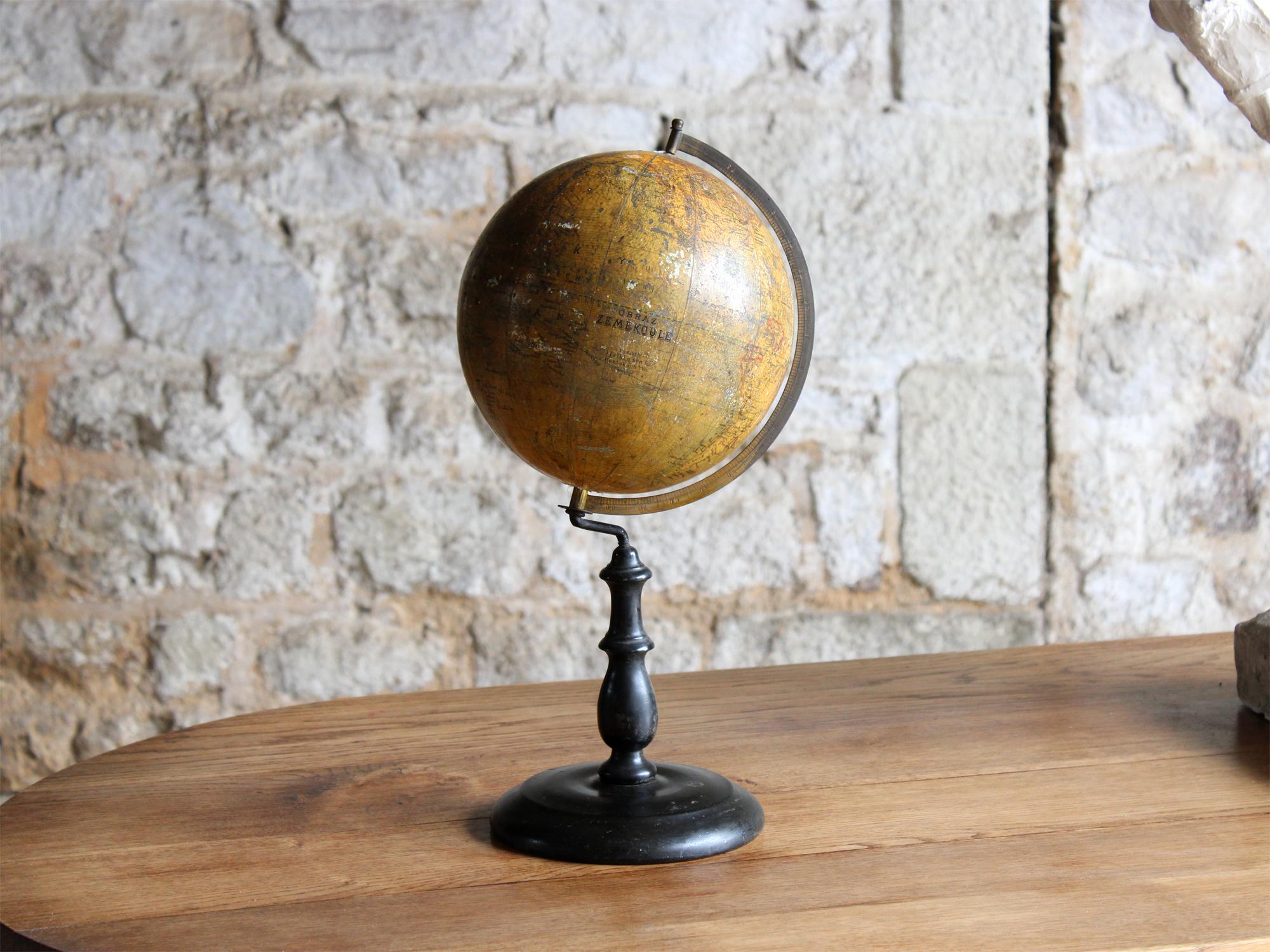 A terrestrial globe by Felkl & Son raised on a turned ebonised stand.

Produced in Rostok, Germany, Circa 1880.

The globe's name, obraz zeměkoule, translates from Czech as 'an image of a globe', with the place names seemingly in Slovak.

In very