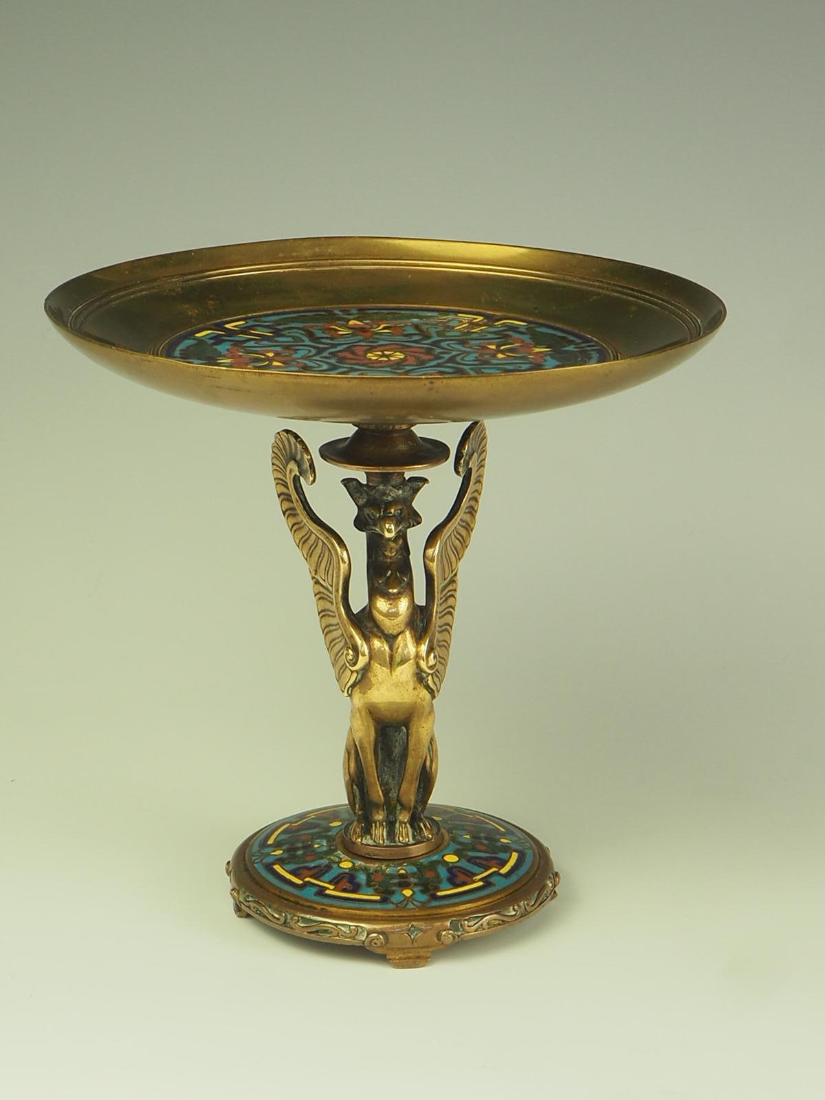 Artwork by Ferdinand Barbedienne (1810-1892) Tazza Dish

The enamel work has an Oriental decorative style with ottoman/ middle estern motifs

The tazza / dish is supported by a nicely detailed Griffin

Stamped Ferdinand Barbedienne

Artist