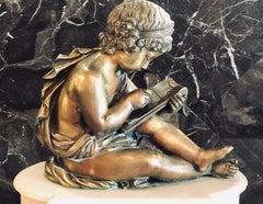 19th Century Figural School Boy Bronze Sitting Atop a Marble Mantle Clock Base