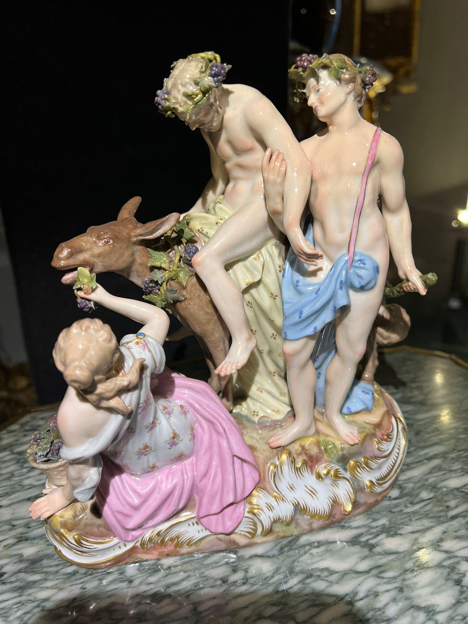 Group of figures ''Drunk Silenus'', Meissen Porcelain, painted in polychrome and gold.

It represents a group of bacchae standing on a stylized rocky pedestal, in the center the drunken Silenus (educator of Dionysus) sitting on a mule having a