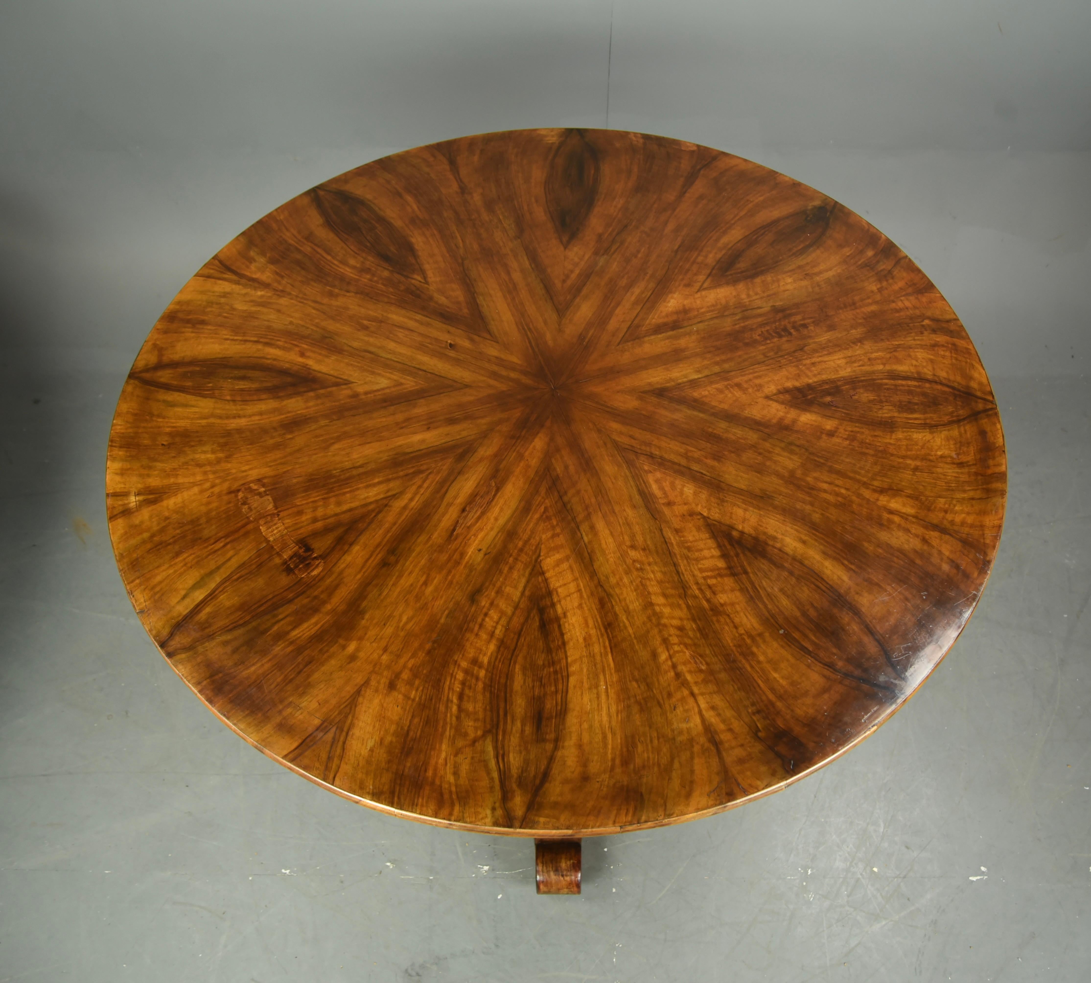Fine quality Swedish radial veneered walnut centre / 6 seat dining table circa 1860.
The table has a fantastic grain and colour to the top with a bur walnut frieze ,standing on a very heavy triform base.
The table stands very solid with loose