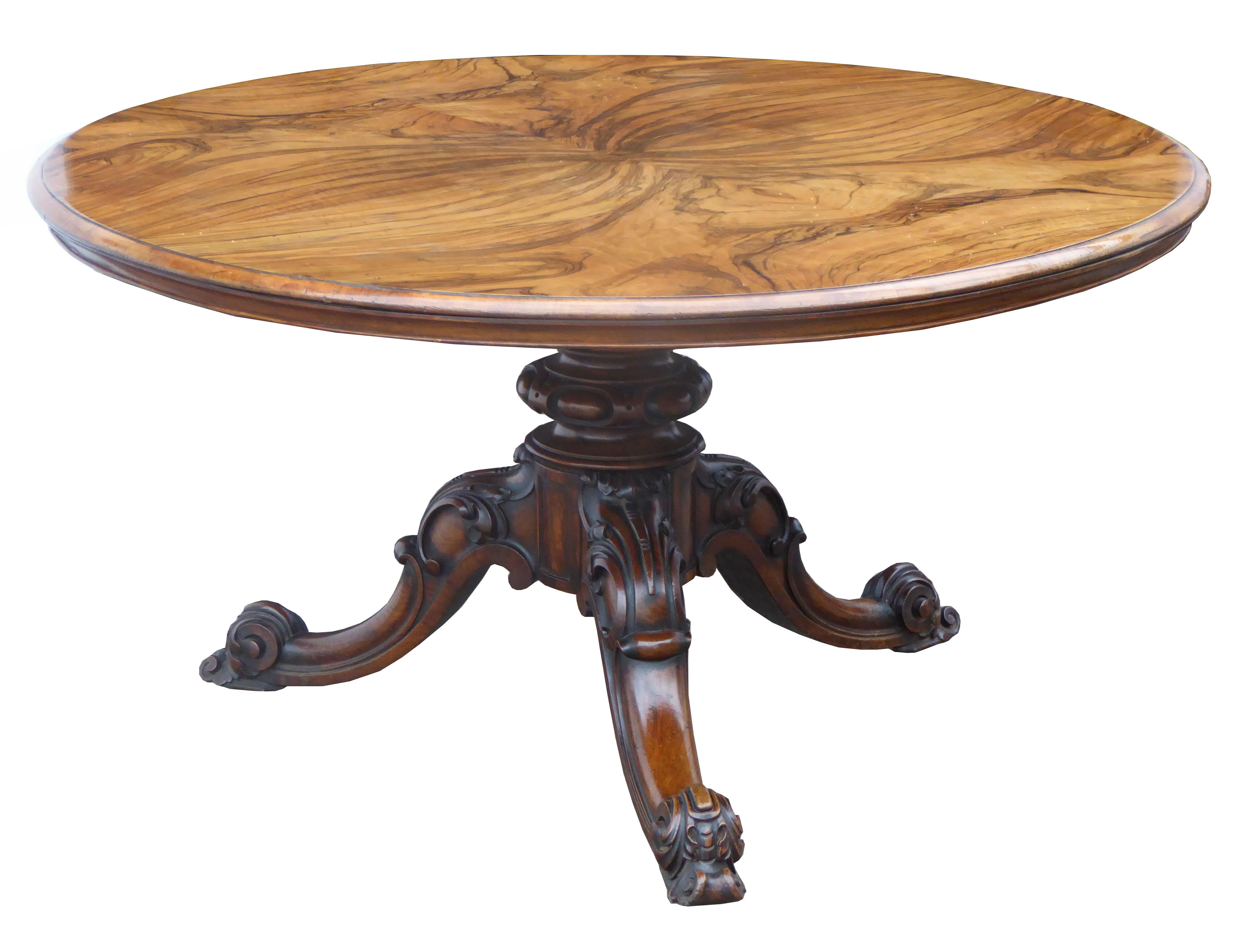 For sale is a good quality Victorian figured walnut circular breakfast table. The top screws onto an ornately carved and turned base, with three legs, each terminating on castors. This table is in excellent condition having been fully re-polished by