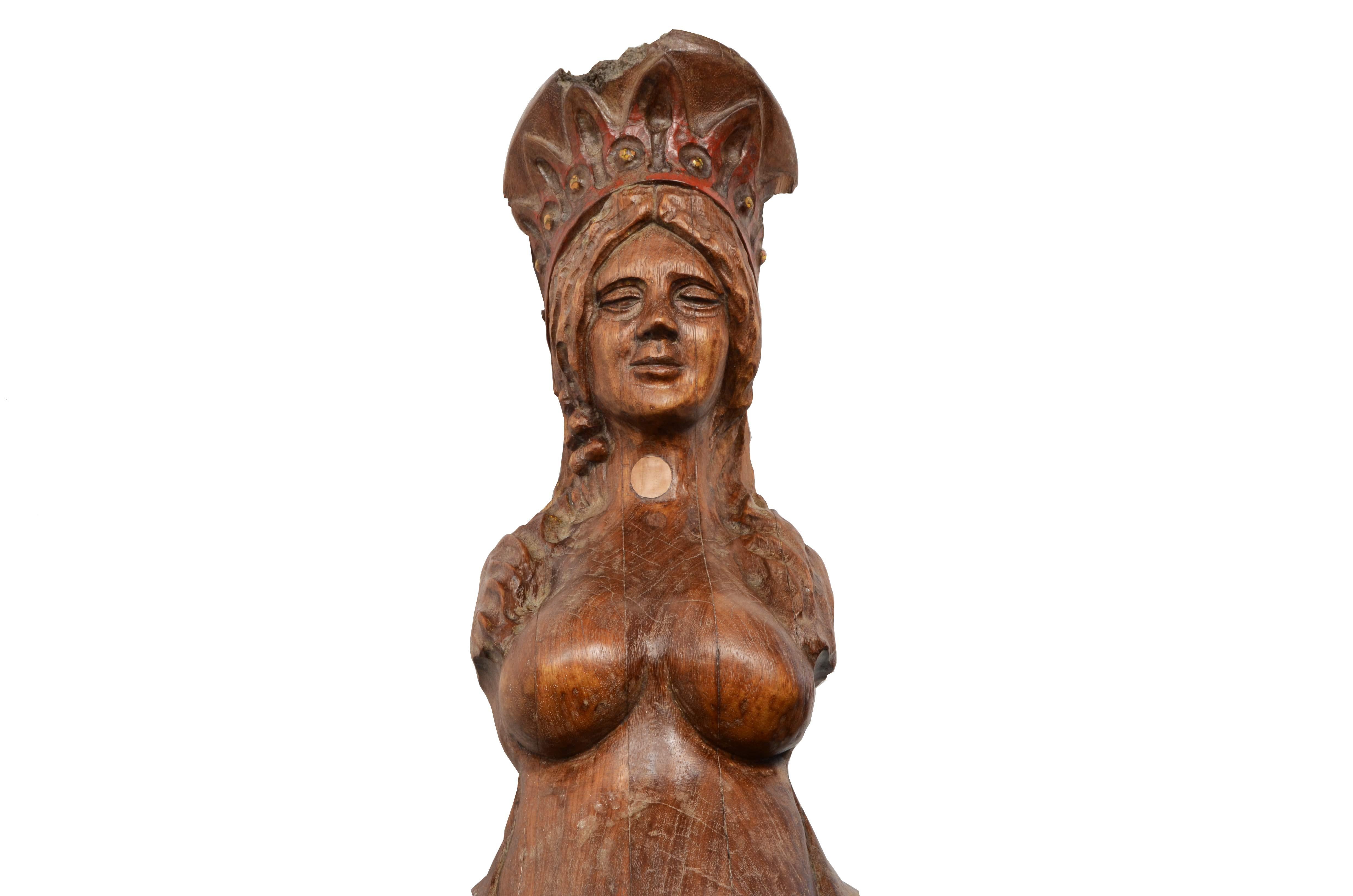 Figurehead in carved oak depicting a female figure whose body has the shape of a siren, symbol of fertility and protection, with female features in the upper part and fish tail instead of legs in the lower one.

Northern European manufacture