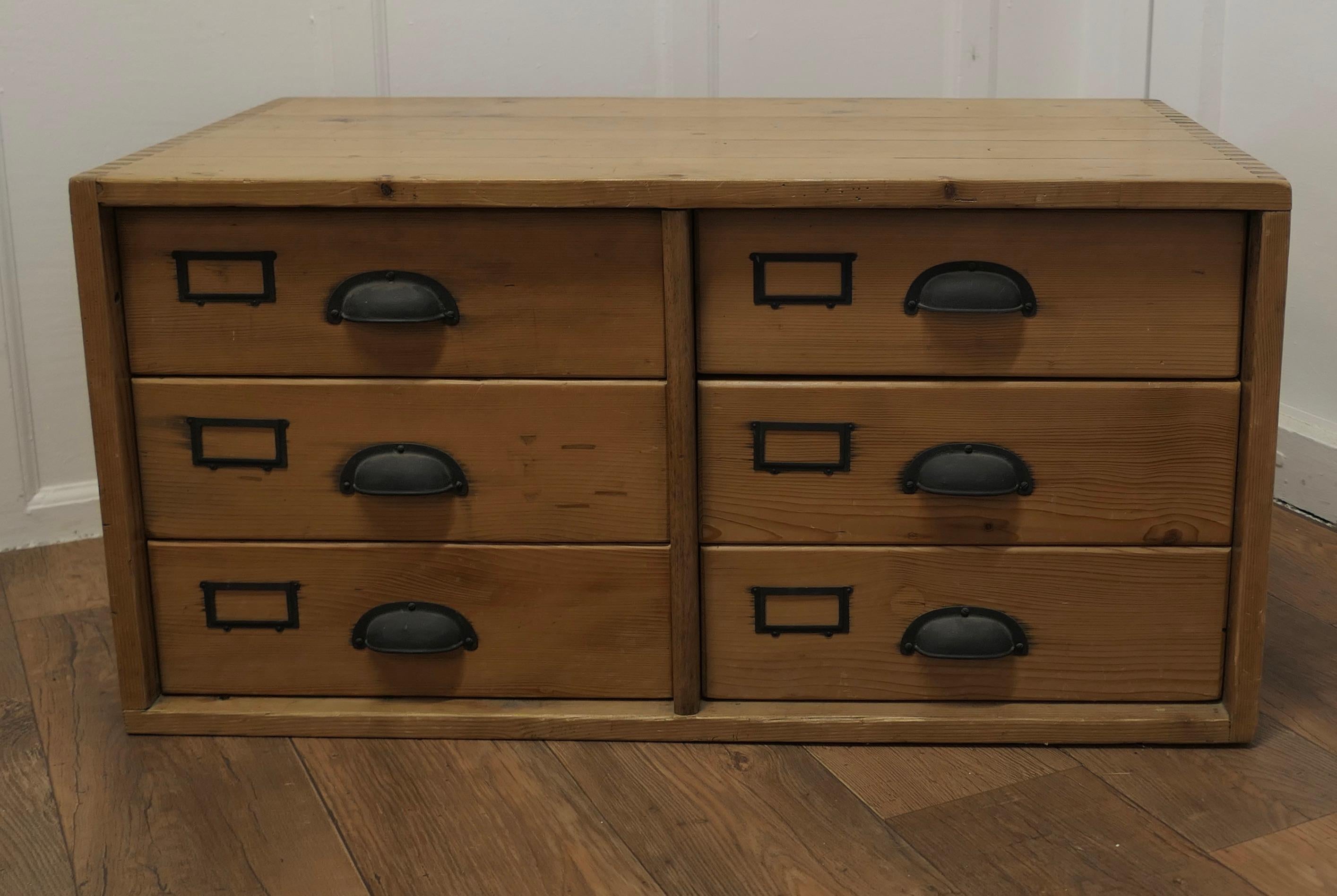19th Century Filing Cabinet Drawers, Coffee Table

This attractive Pine Filing Cabinet has 6 drawers, some of these have dividers inside, they can be used as a side table or  coffee table with storage inside
The chest has 6 drawers with a label