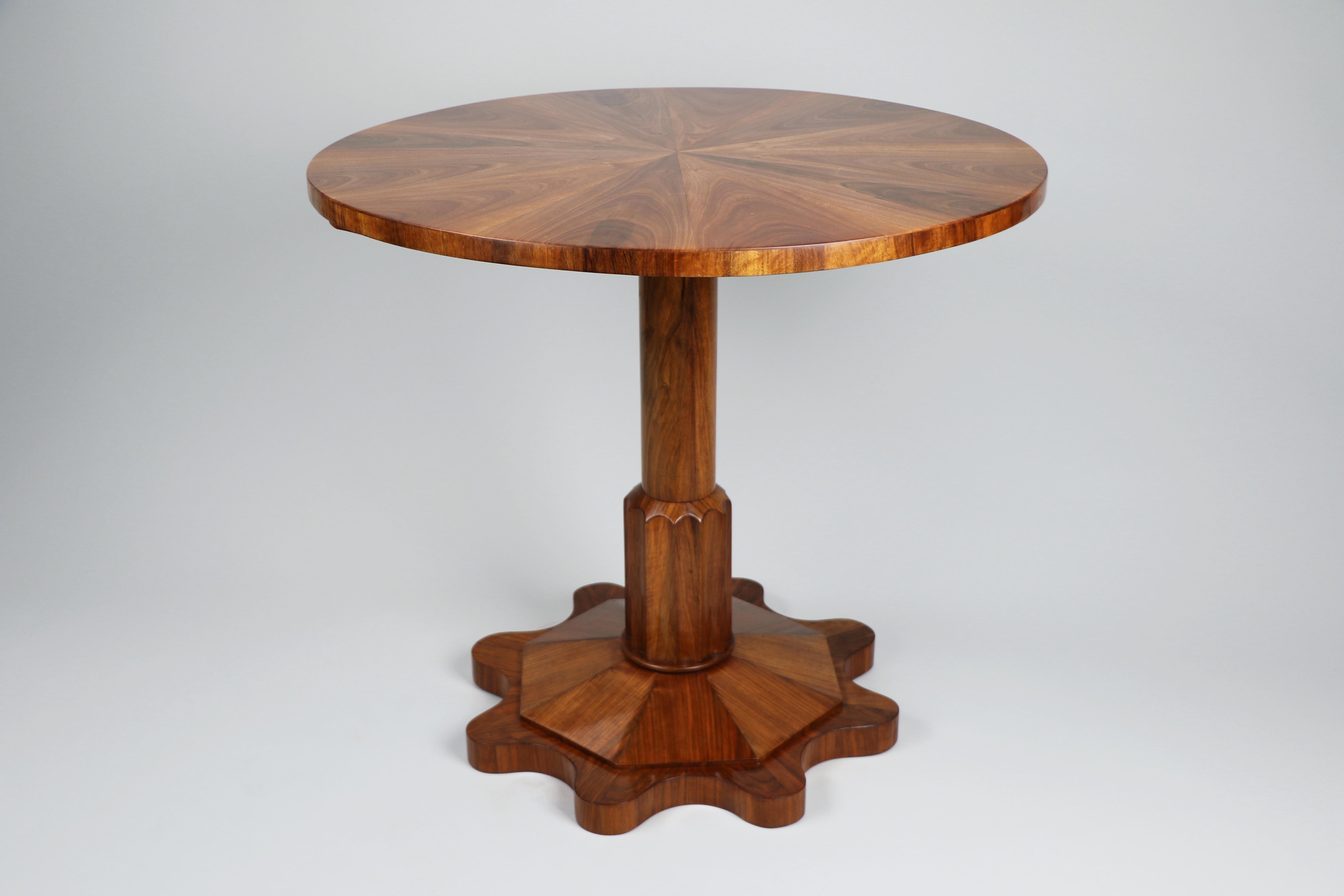 Dear Sir/Madam,

It is with great pleasure that we present this exquisite Biedermeier walnut table, crafted in Vienna circa 1825. This exceptional piece stands as a testament to the artistry and craftsmanship of the early 19th century, embodying the