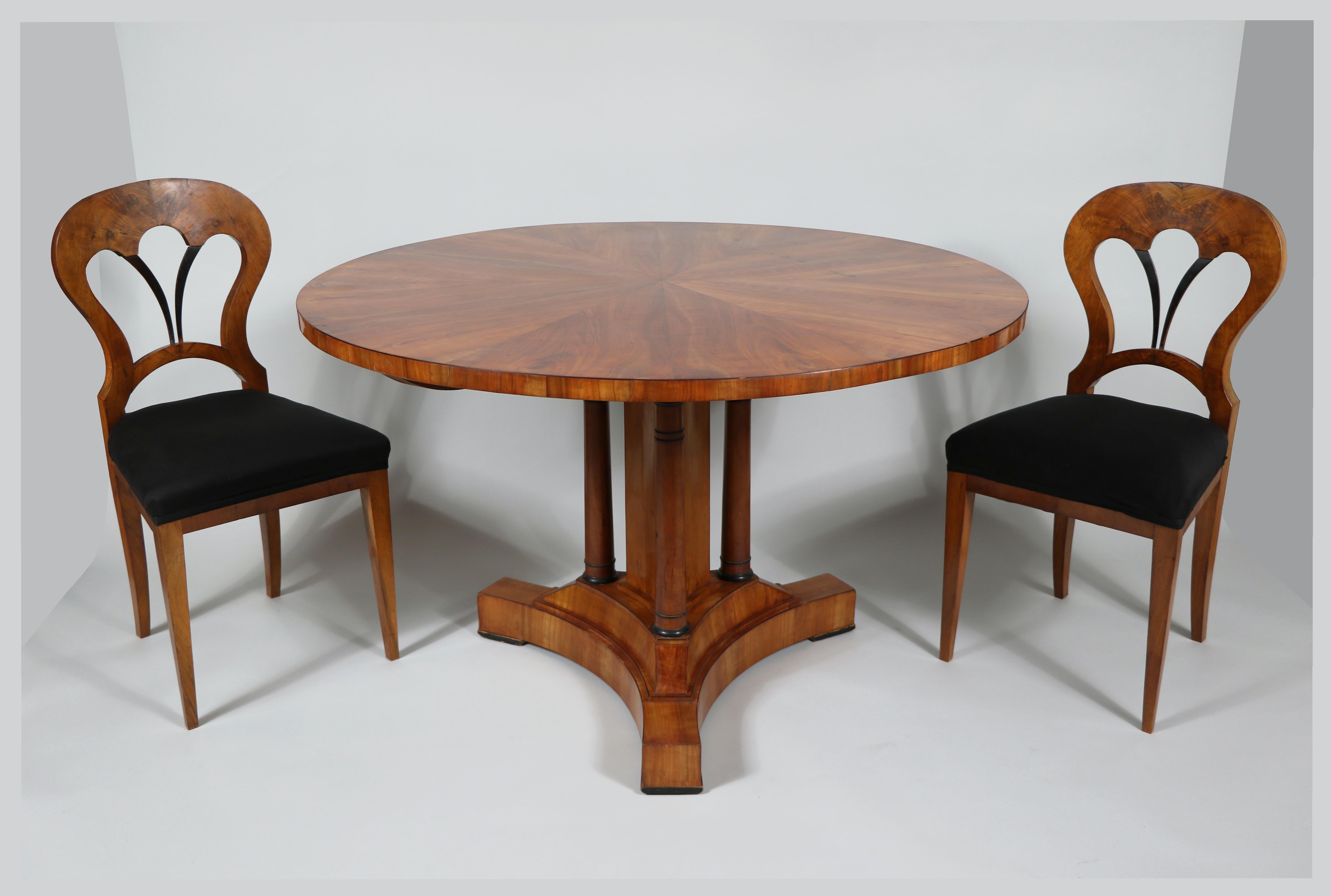 Hello,
We would like to offer you this fine Biedermeier set of six chairs and the large round table.
The set was made in Vienna circa 1825.

Viennese Biedermeier is distinguished by their sophisticated proportions, rare and refined design and