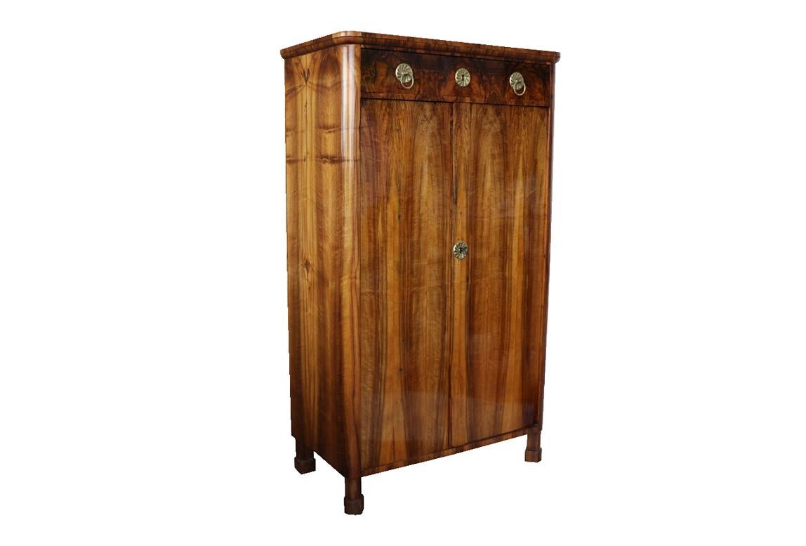 Hello,
This elegant tall Biedermeier trumeau tall chest was made in Vienna circa 1825.

Viennese Biedermeier is distinguished by their sophisticated proportions, rare and refined design and excellent craftsmanship and continue to have a great