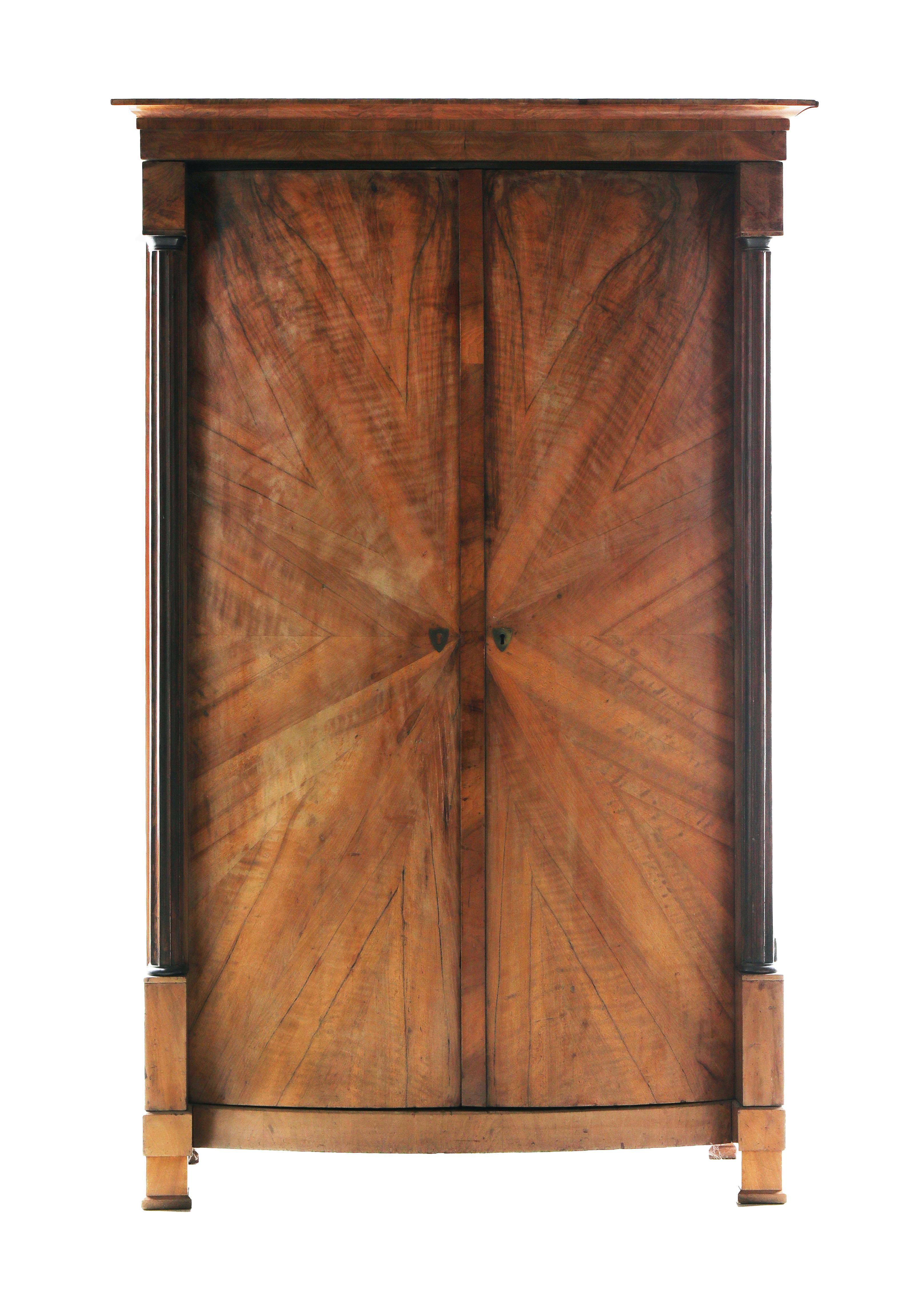 Hello,
We would like to offer you this truly exquisite, early Biedermeier walnut armoire. The piece was made in Vienna circa 1825.

Viennese Biedermeier is distinguished by their sophisticated proportions, rare and refined design and excellent