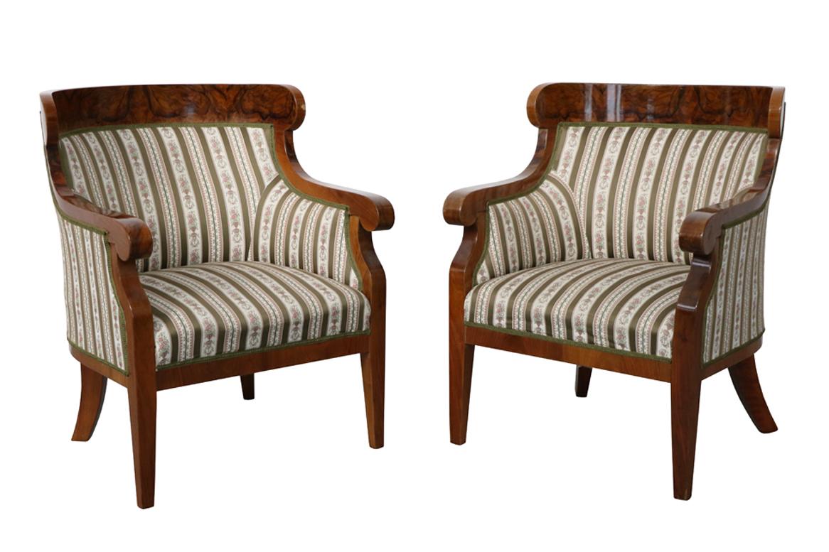 Hello,
This fine and elegant pair of Viennese Biedermeier bergeres were made circa 1825-30.

Viennese Biedermeier is distinguished by their sophisticated proportions, rare and refined design and excellent craftsmanship and continue to have a great