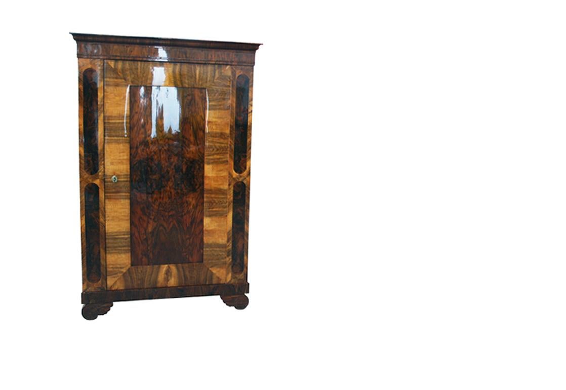 Hello,
We would like to offer you this truly exquisite, early Biedermeier walnut cabinet. The piece was made in Vienna circa 1830.

Viennese Biedermeier is distinguished by their sophisticated proportions, rare and refined design and excellent