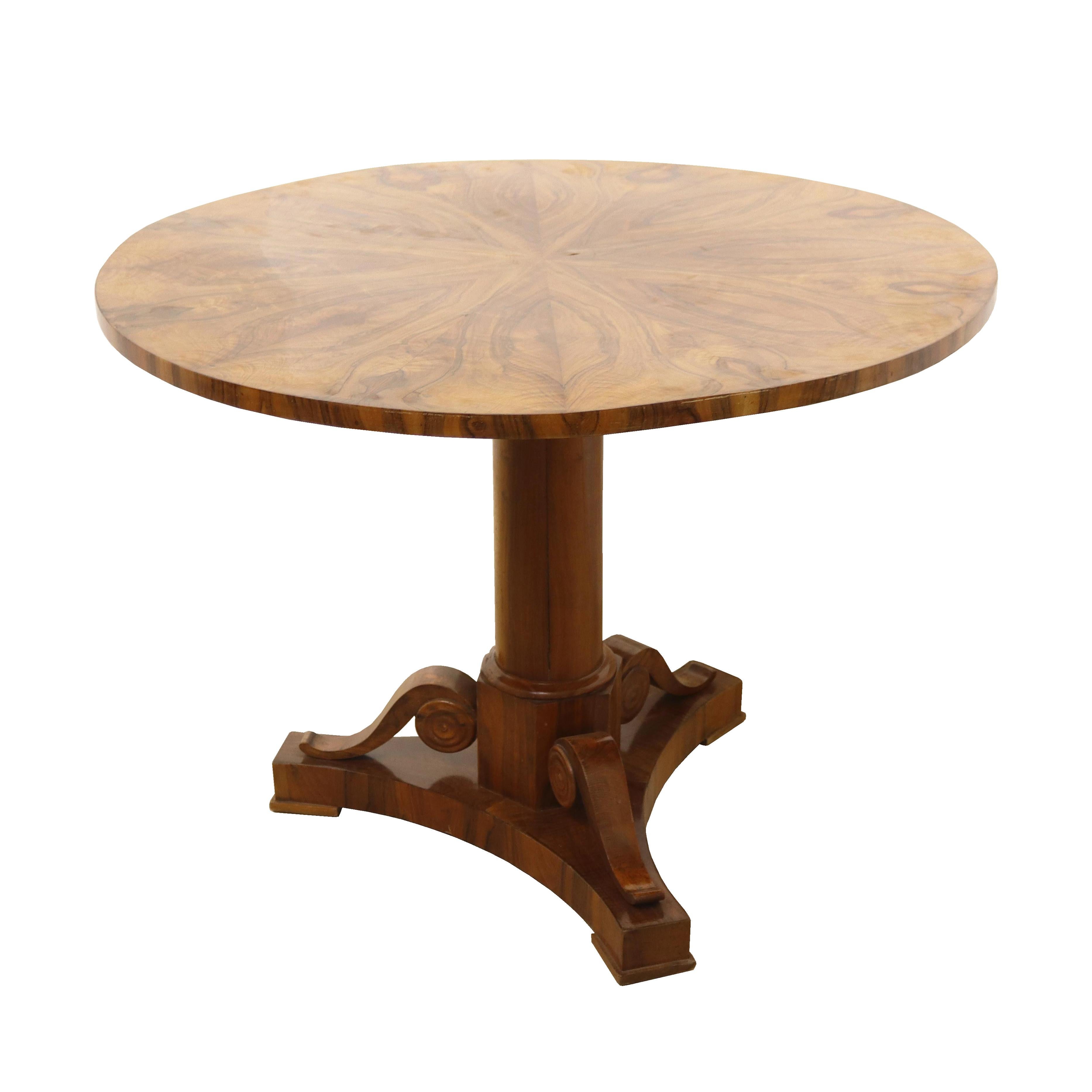 Hello,
This exceptional Biedermeier walnut pedestal table was made in Vienna, c. 1825.

Viennese Biedermeier is distinguished by their sophisticated proportions, rare and refined design and excellent craftsmanship and continue to have a great