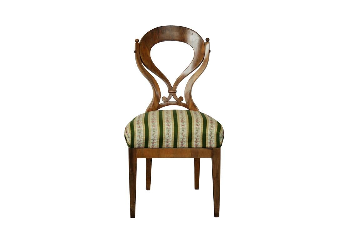 Hello,
This fine Biedermeier side chair was made in Vienna circa 1825.

Viennese Biedermeier pieces are distinguished by their sophisticated proportions, rare and refined design, excellent craftsmanship and continue to have a great influence on