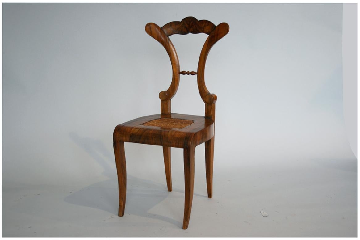 Hello,
This fine Biedermeier side chair was made in Vienna circa 1825.

Viennese Biedermeier pieces are distinguished by their sophisticated proportions, rare and refined design, excellent craftsmanship and continue to have a great influence on