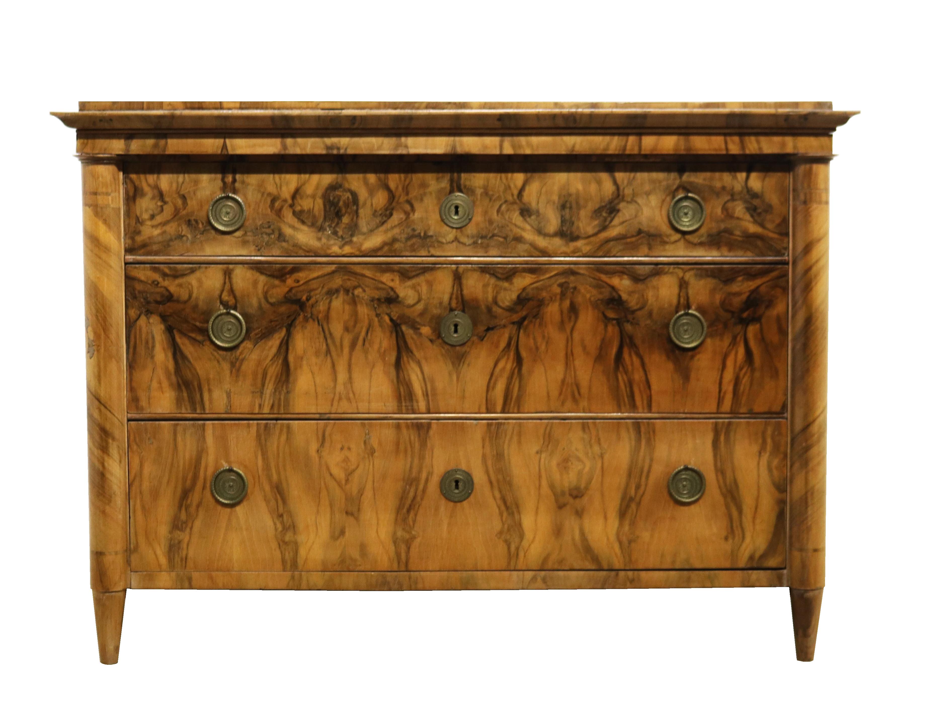 We would like to offer you this truly exquisite, early Biedermeier walnut commode. The piece was made in Vienna circa 1825.

Viennese Biedermeier is distinguished by their sophisticated proportions, rare and refined design and excellent