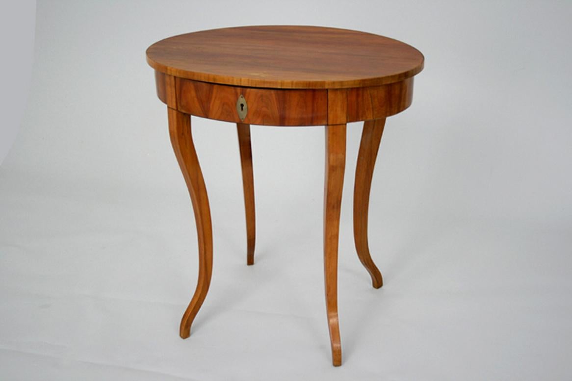 Hello,
This elegant Biedermeier cherry side table was made circa 1830 in Vienna.

Viennese Biedermeier pieces are distinguished by their sophisticated proportions, rare and refined design, excellent craftsmanship and continue to have a great