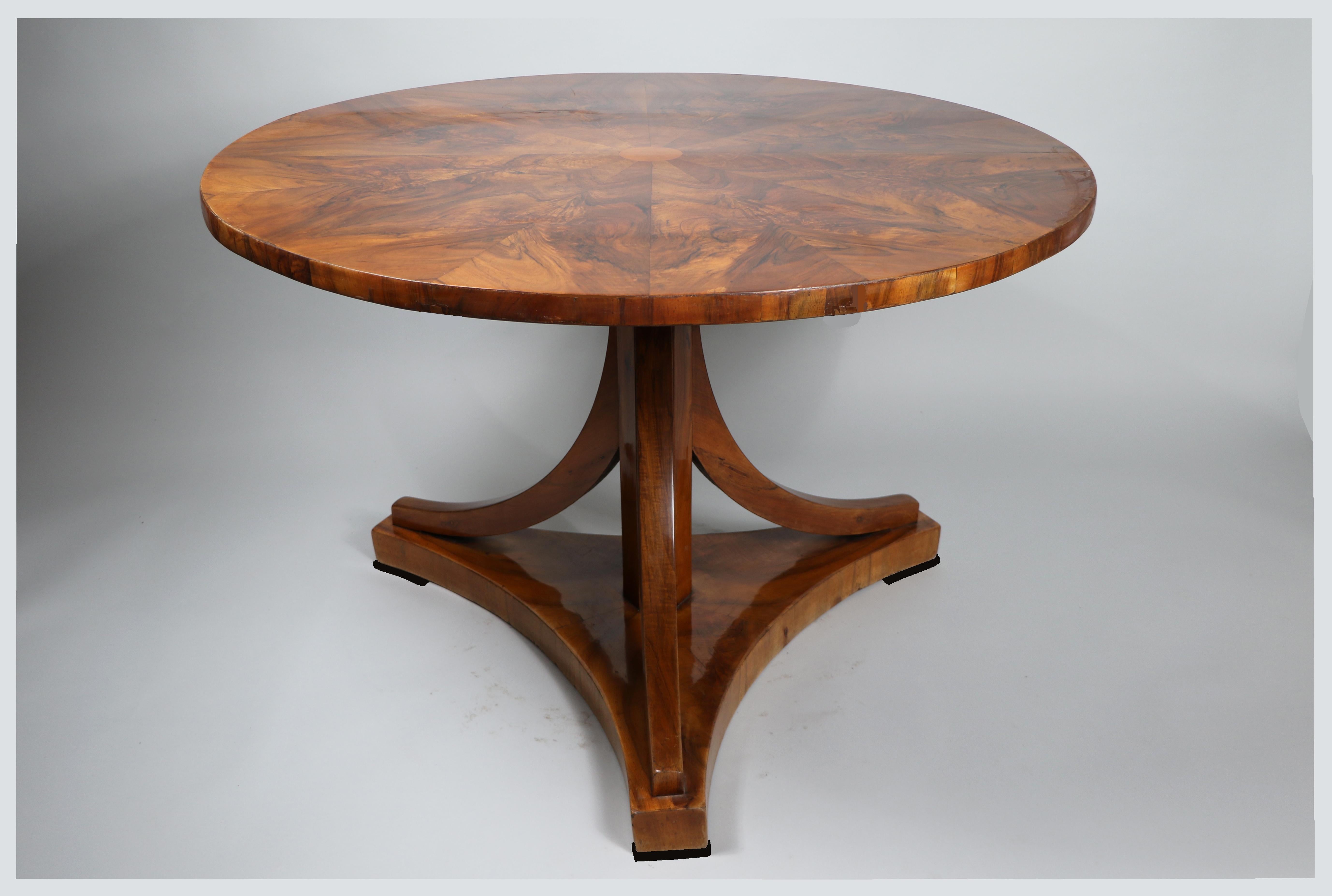 Hello,

This fine Biedermeier walnut table was made in Vienna circa 1825.

Viennese Biedermeier pieces are distinguished by their sophisticated proportions, rare and refined design, excellent craftsmanship and continue to have a great influence on
