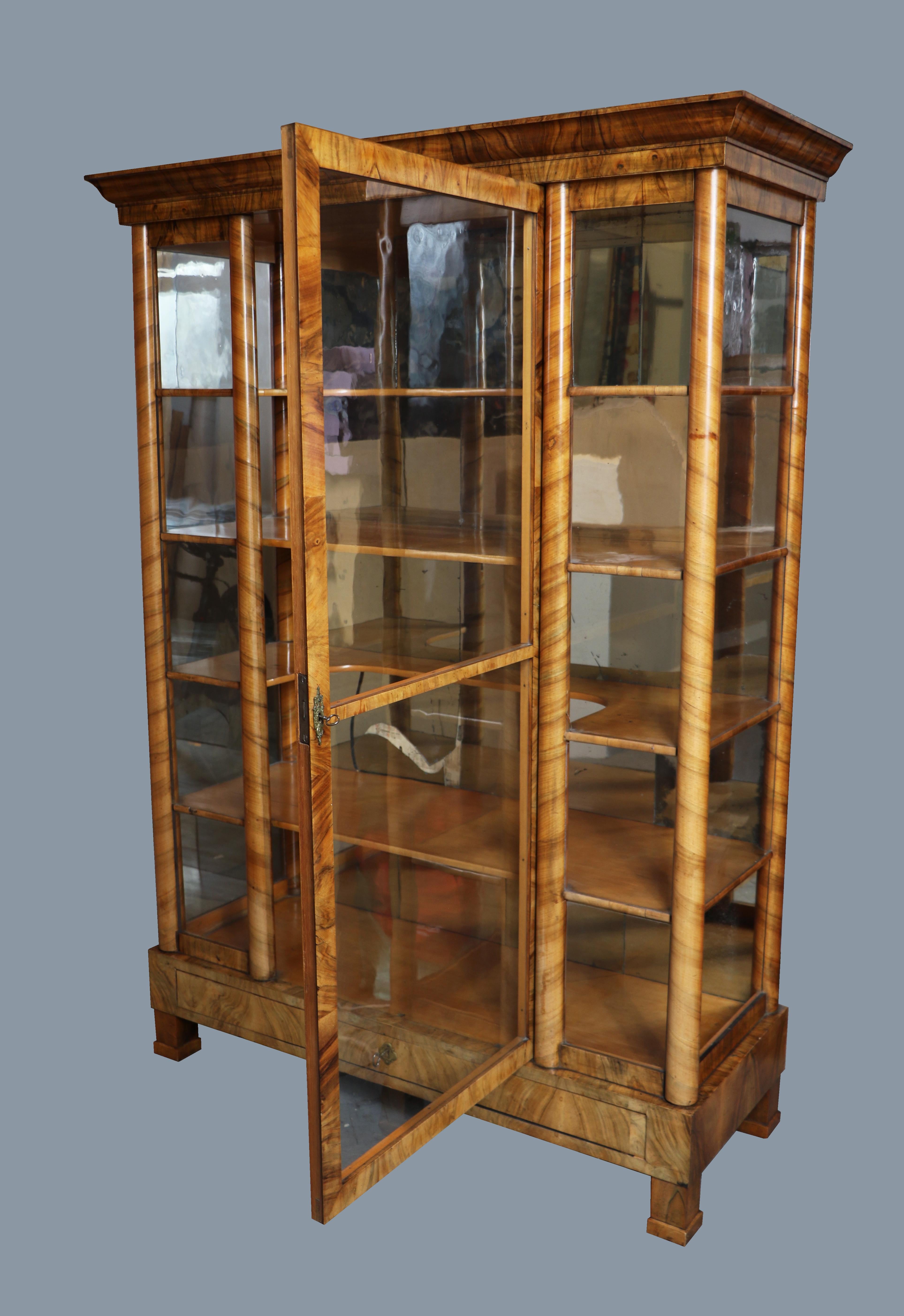 Hello,
We would like to offer you this truly exquisite, early Biedermeier walnut vitrine. The piece was made in Vienna circa 1820-25.

Viennese Biedermeier is distinguished by their sophisticated proportions, rare and refined design and excellent