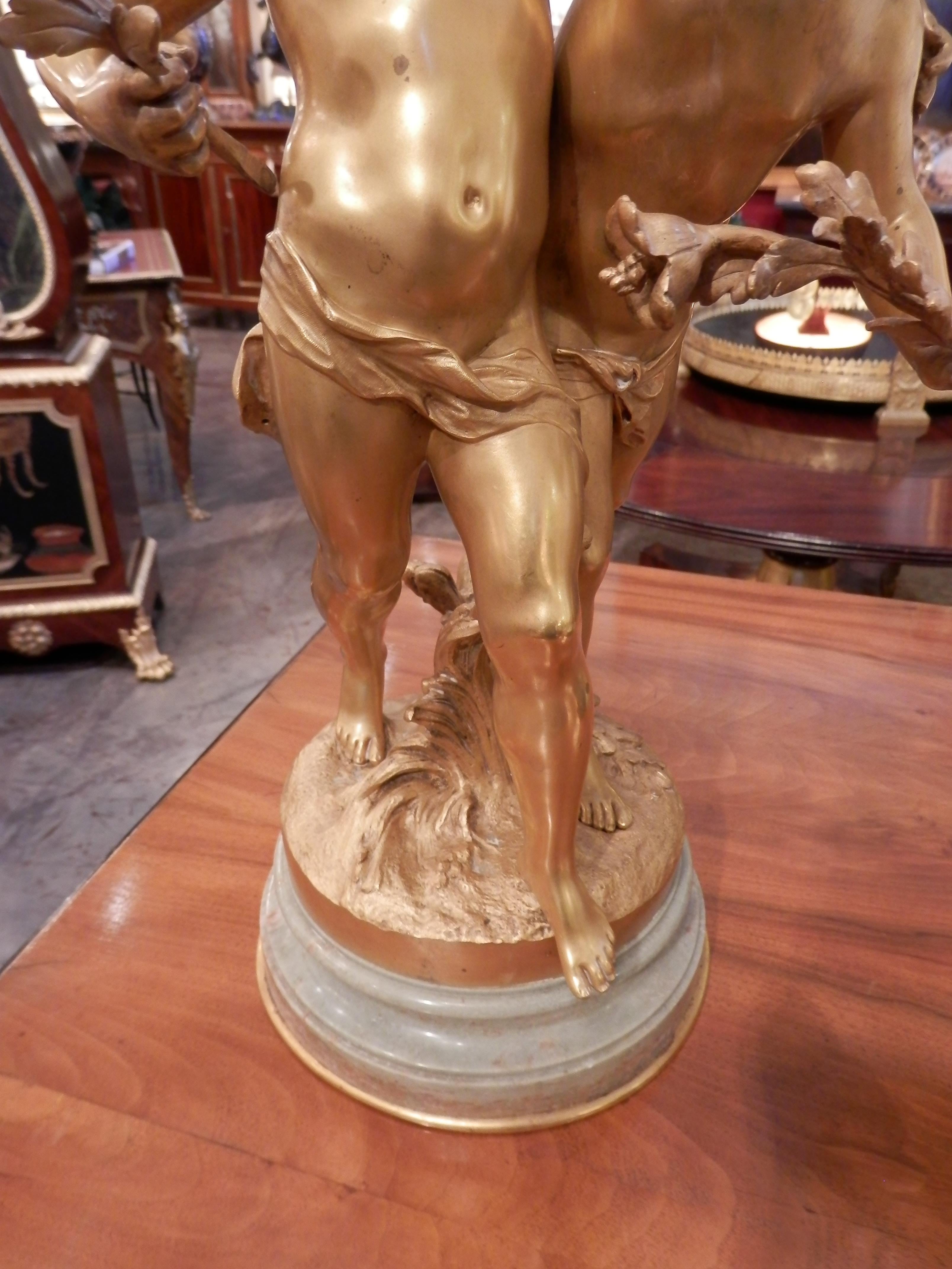 Beautiful 19th century fine French gilt bronze of two children possibly a brother and a sister signed Aug Moreau. Light foam green marble base. Finest quality charming scene.