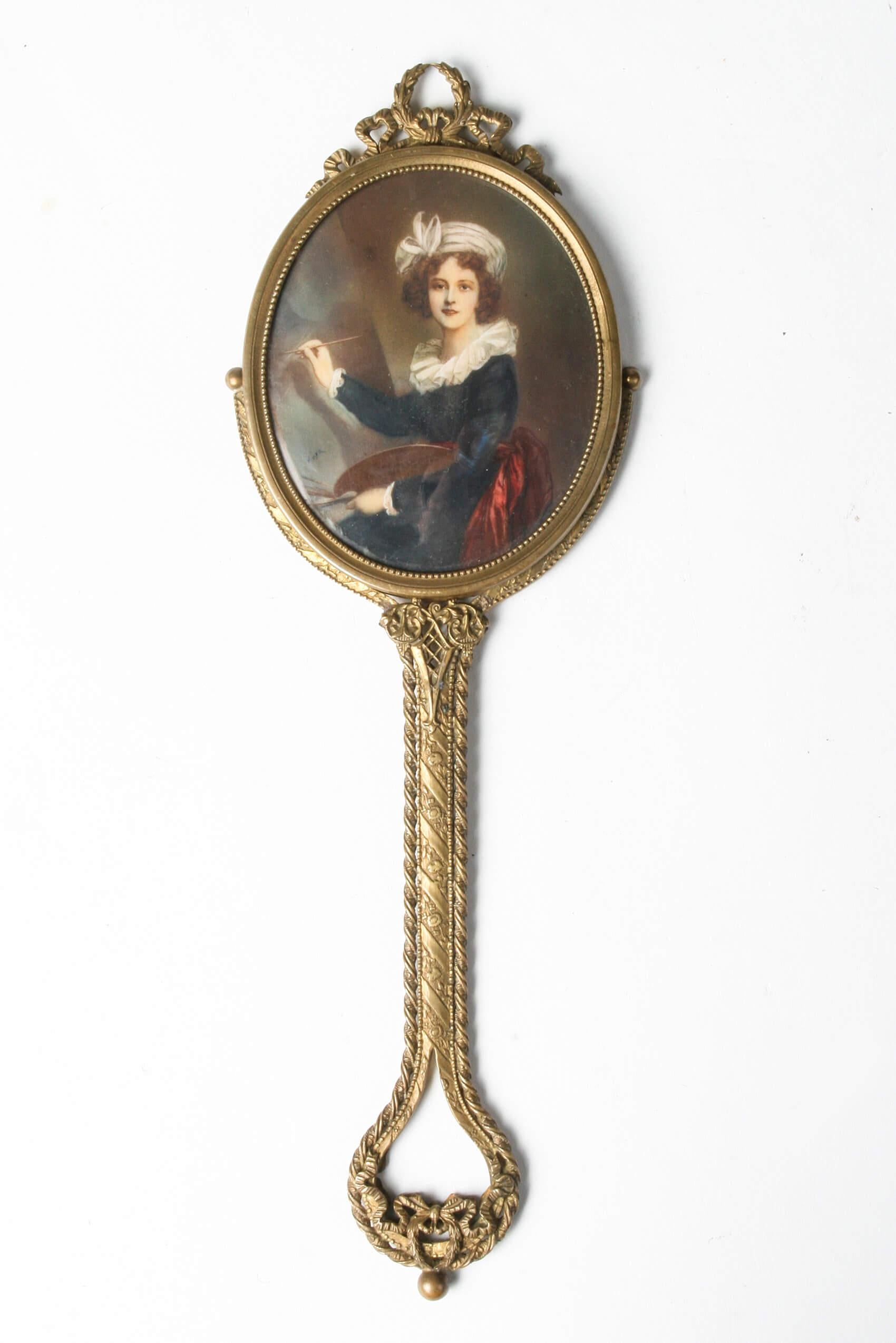 Beautiful hand mirror with very refined details.
Originating from France, Napoleon III style.
The mirror is made of bronze and decorated with laurel wreaths, ribbons and bows. It is a double-sided mirror. There is a mirror on one side, with