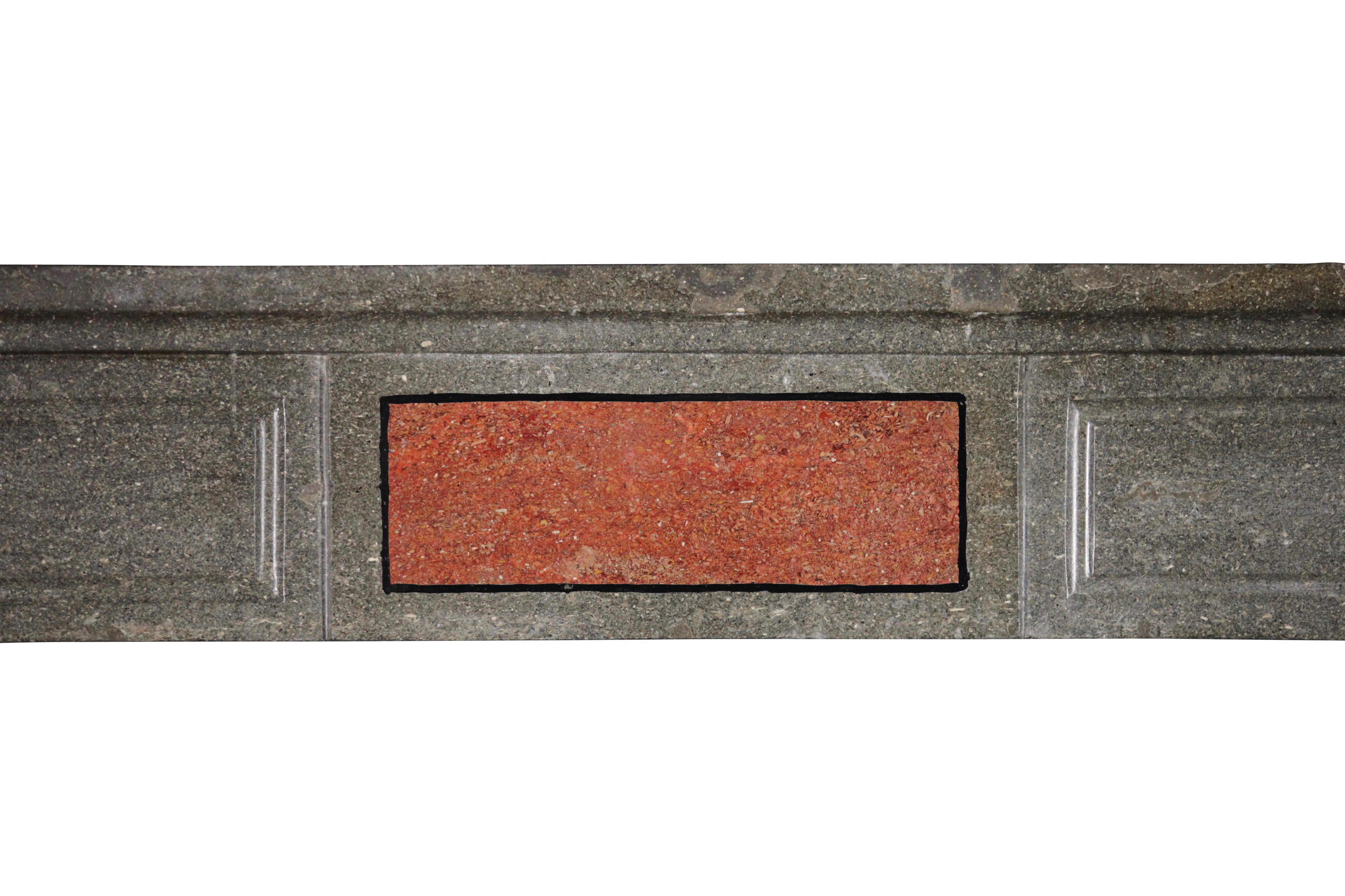 A quite special original antique fireplace surround in Burgundy bicolor marble hard stone with porfierstone inlay. The different colors and straight lines makes that this could perfectly match a Art-Deco or modern interior to a pured minimalistique