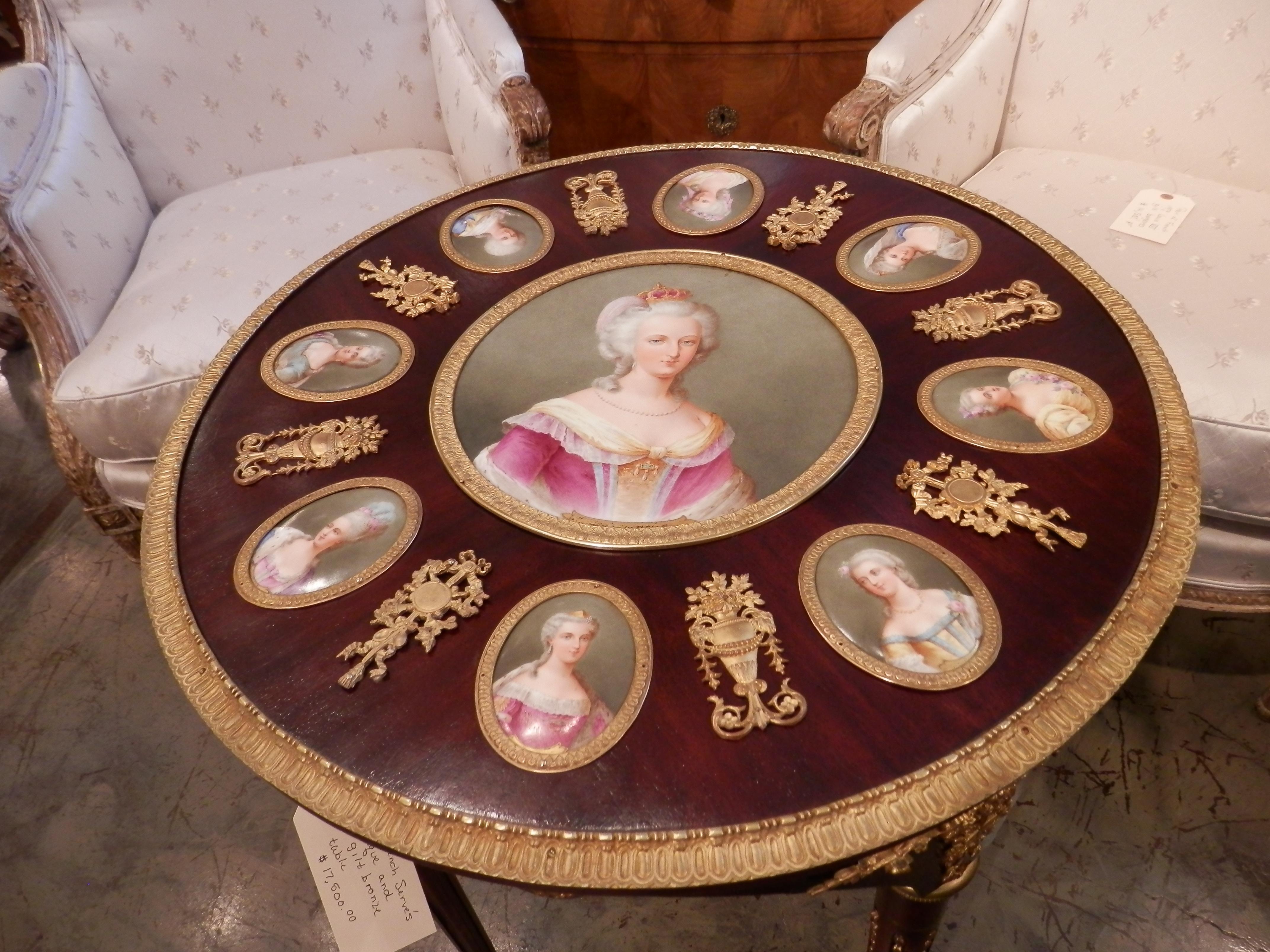 Beautiful 19th century French Serve's porcelain plaque salon table. Depicting Marie Antoinette and her court. Fine mercury gilt bronze mounts.